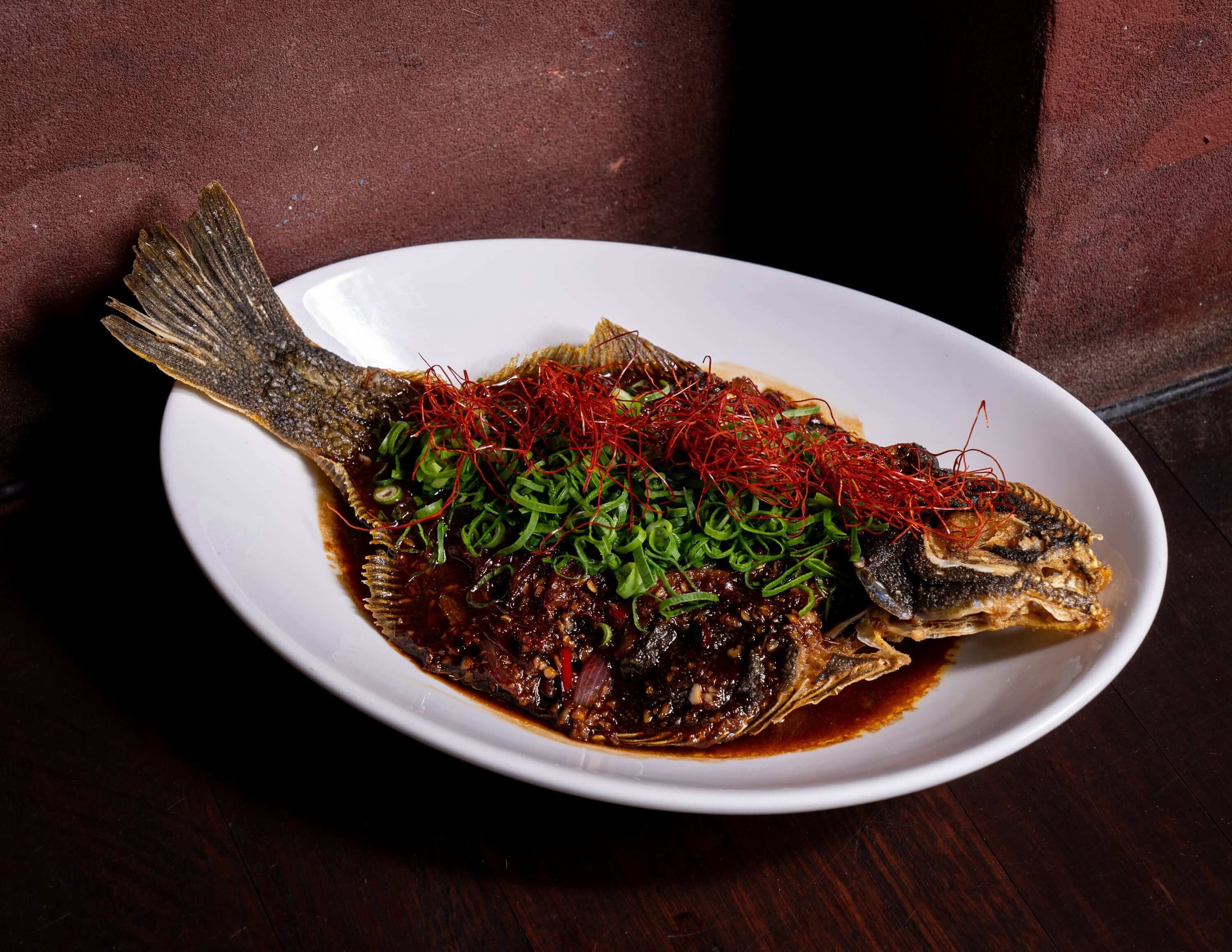 Whole fish presented with a side of rice