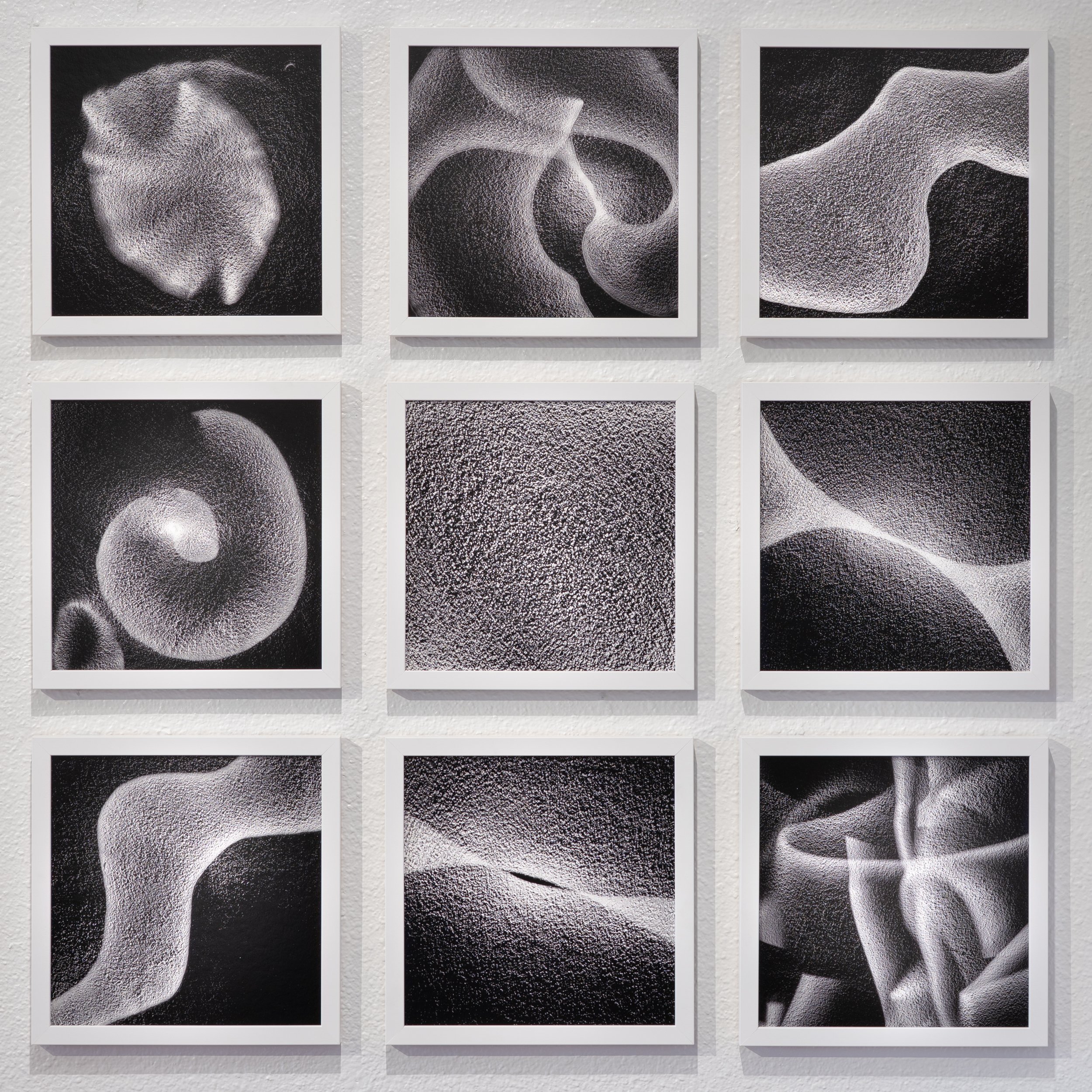 Black and white smaller square images that are grouped 3x3