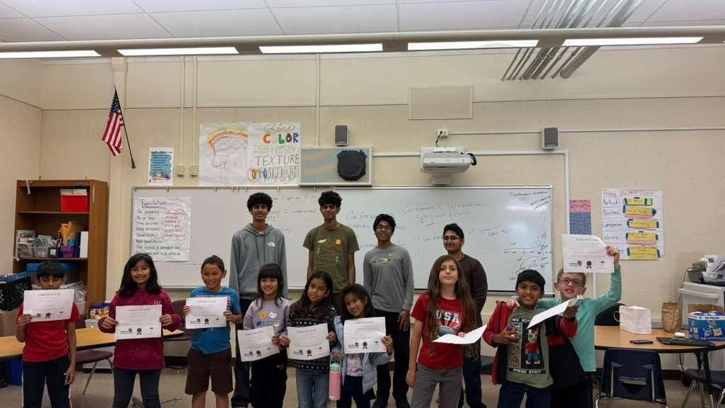 InfiniBots students working with community members