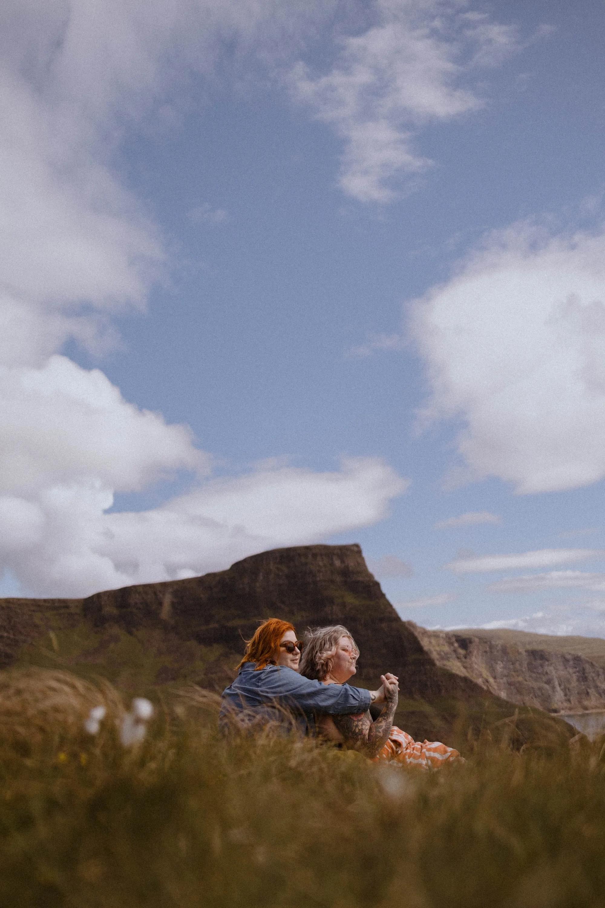 The Underwoods sit on a hillside in Scotland on their honeymoon in 2024.