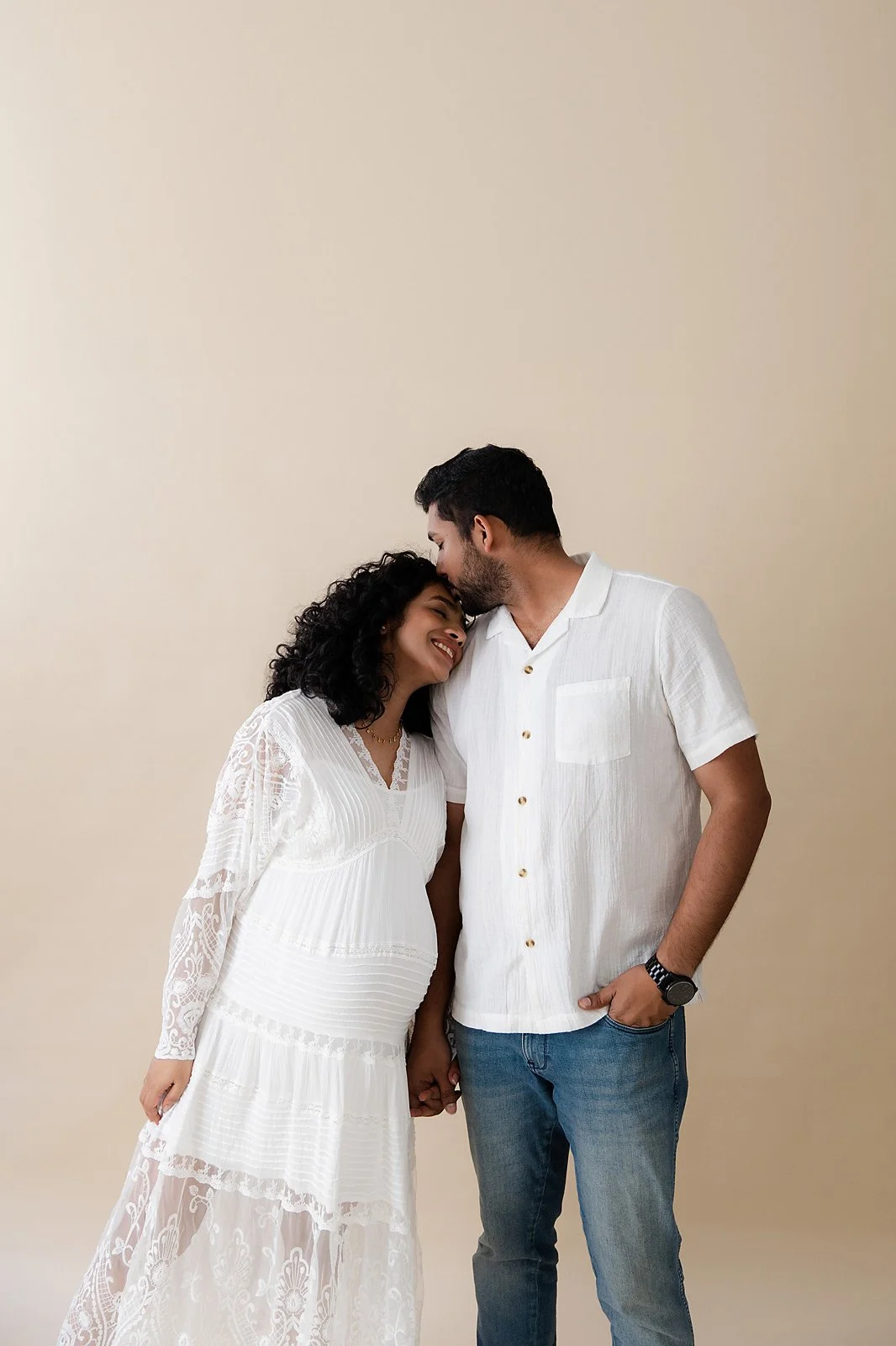 candid-moment-between-couple-during-their-maternity-session-in-Sydney-photography-studio.jpg