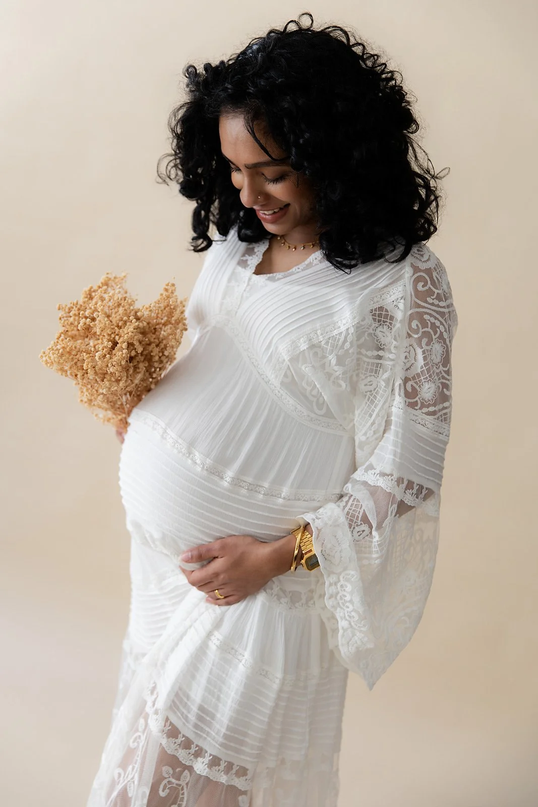 Professional maternity portrait of mum with a round bump in Sydney studio