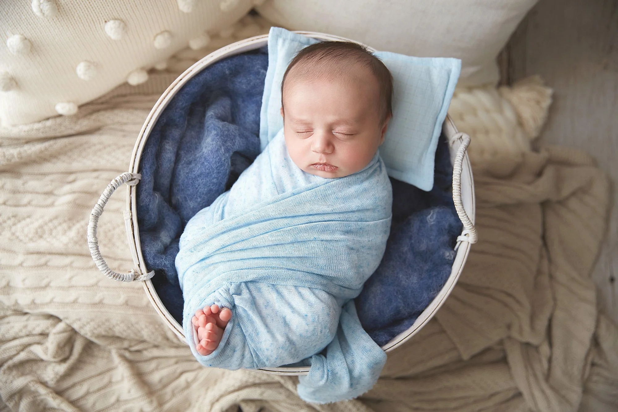 newborn-boy-wrapped-and-posed-in-a-round-basket-in-a-boho-vibes-set-up_MD2A5305-copy.jpg