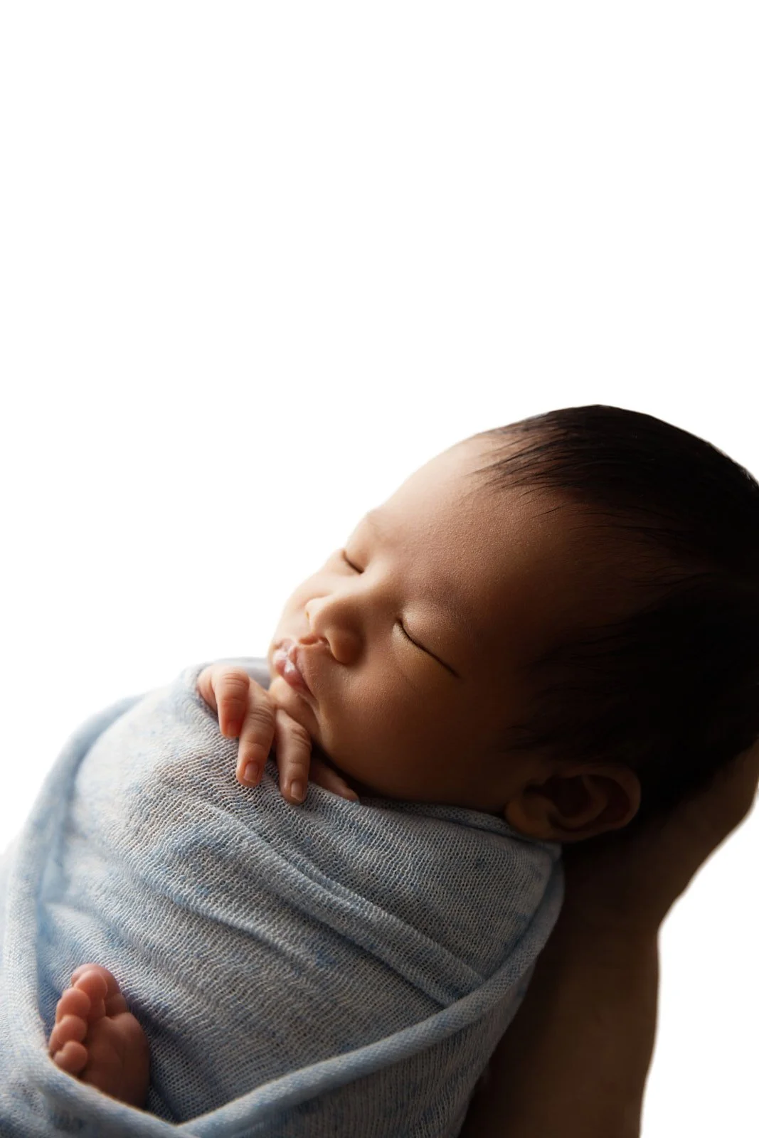Close up of newborn baby facial details, natural light studio