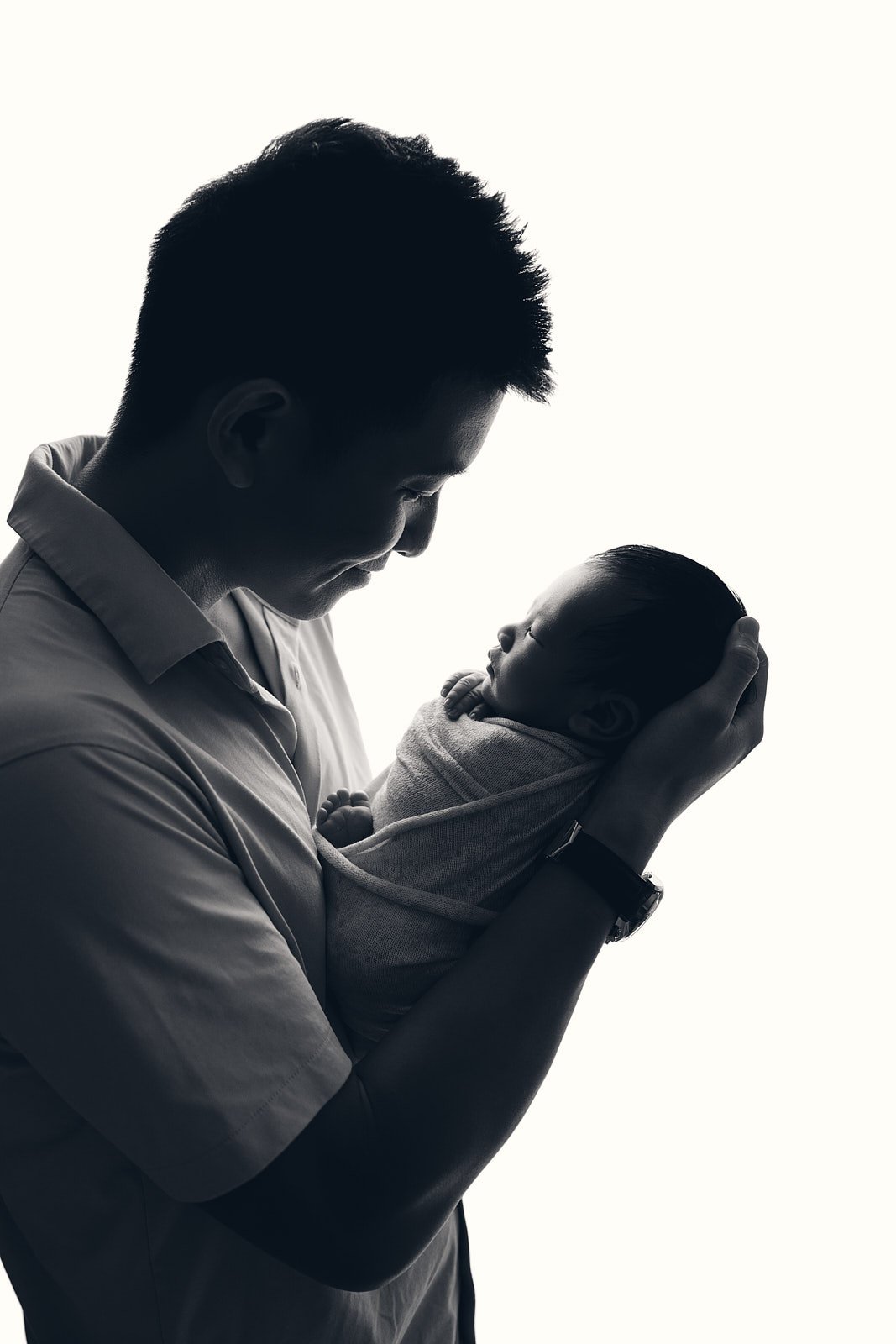 Father’s hands holding newborn baby, Hills District photography