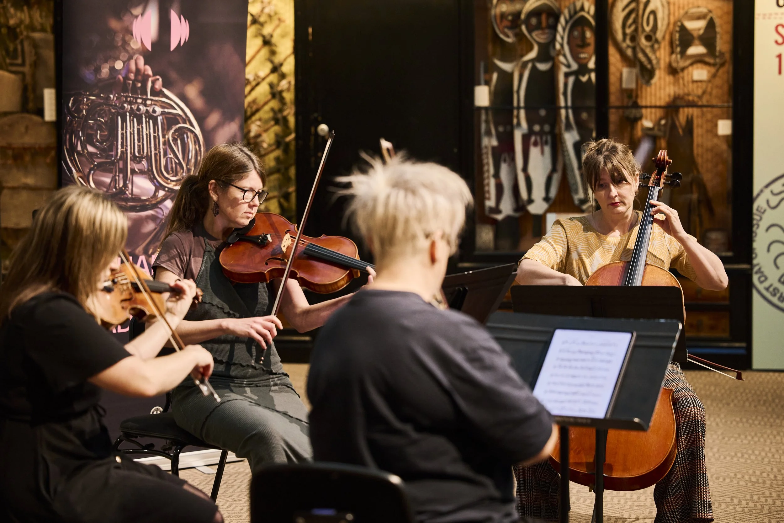 String Quartet 4EPQ are playing in an intimate exhibition space inside the South Australian Museum as part of Chamber Music Adelaide's On the Terrace Festival, photographed by Claudio Raschella in 2024.