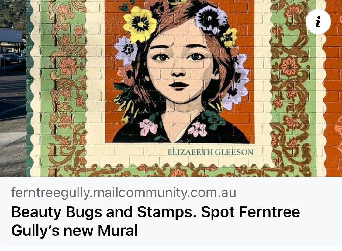 Colorful mural of a young woman's portrait with flowers in her hair, painted on a brick wall. The woman has brown hair, dark eyes, and a neutral expression. The mural is framed with decorative floral patterns and the text 'Elizabeth Gleeson' is written at the bottom.