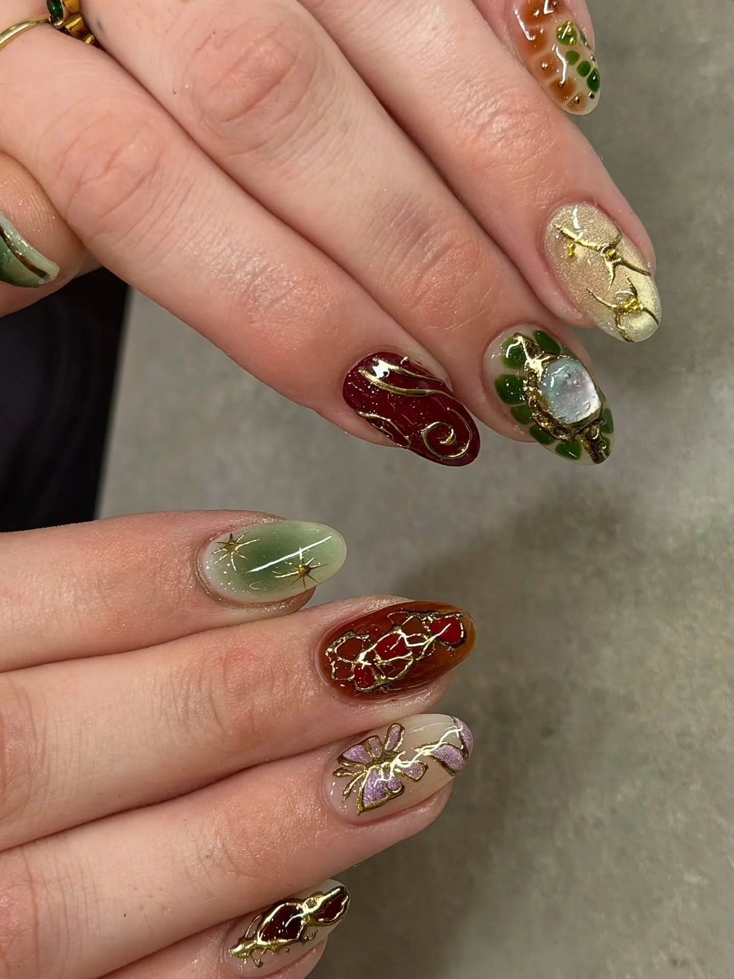 Gorgeous crystals and chrome art on this set of nails. 💚

This set is so perfect for autumn. 🍂 

Nails by Senior Artist, Tracy. 🤎

Fall nails. Autumn nails. Nail trends. Trending nails. Chrome nails. Aura nails. Butterfly nails. Nail charms. Nail 