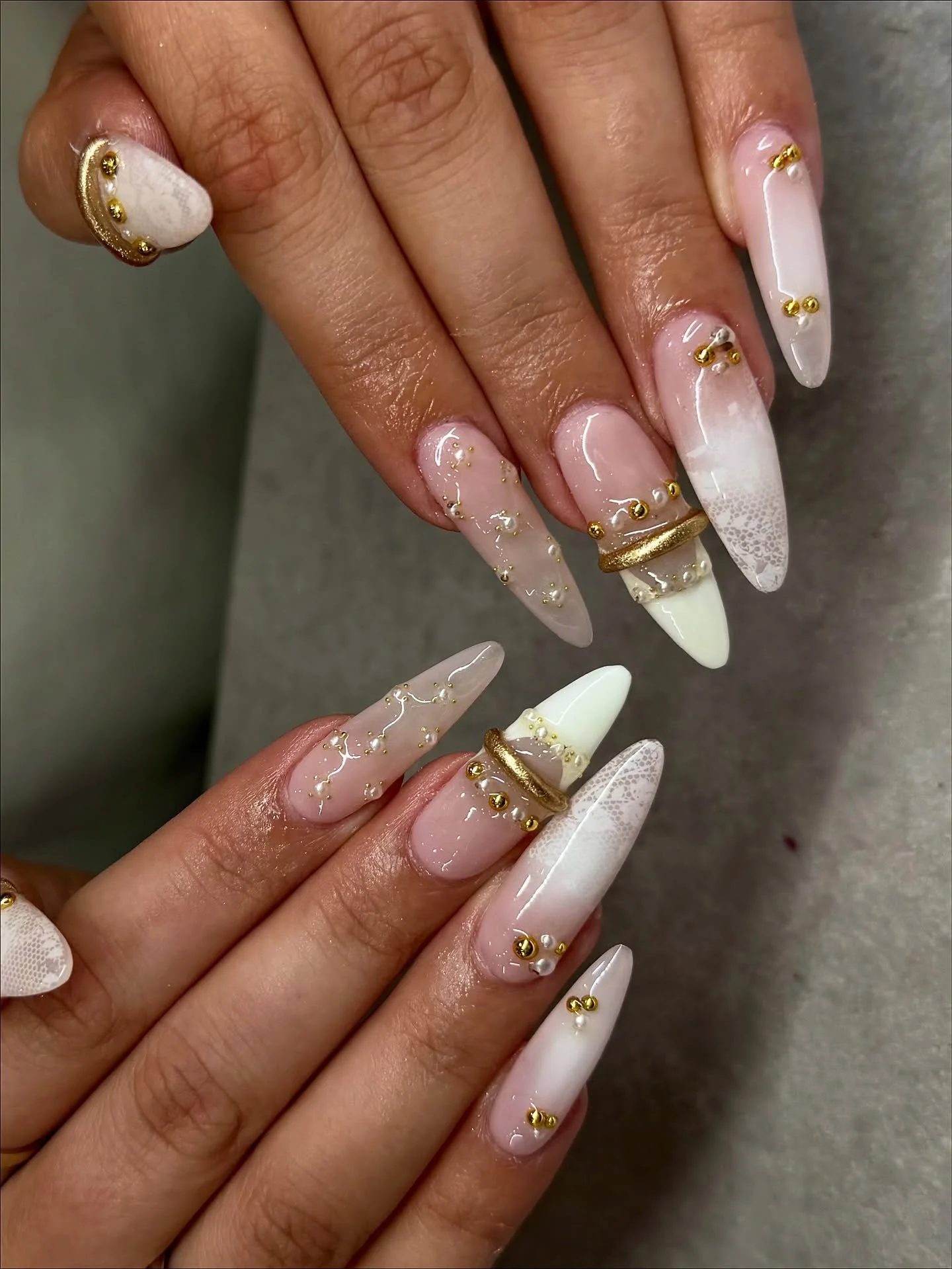 We think we&rsquo;ve found our new favourite nail set!

White bridal nails with gold rings. 🤍

Nails by Master Artist, Amy. 🔑

Gel nail art. Nail extensions. Lace nails. White nails. French tip nails. Almond shaped nails. Nail gems. Bridal nails. B