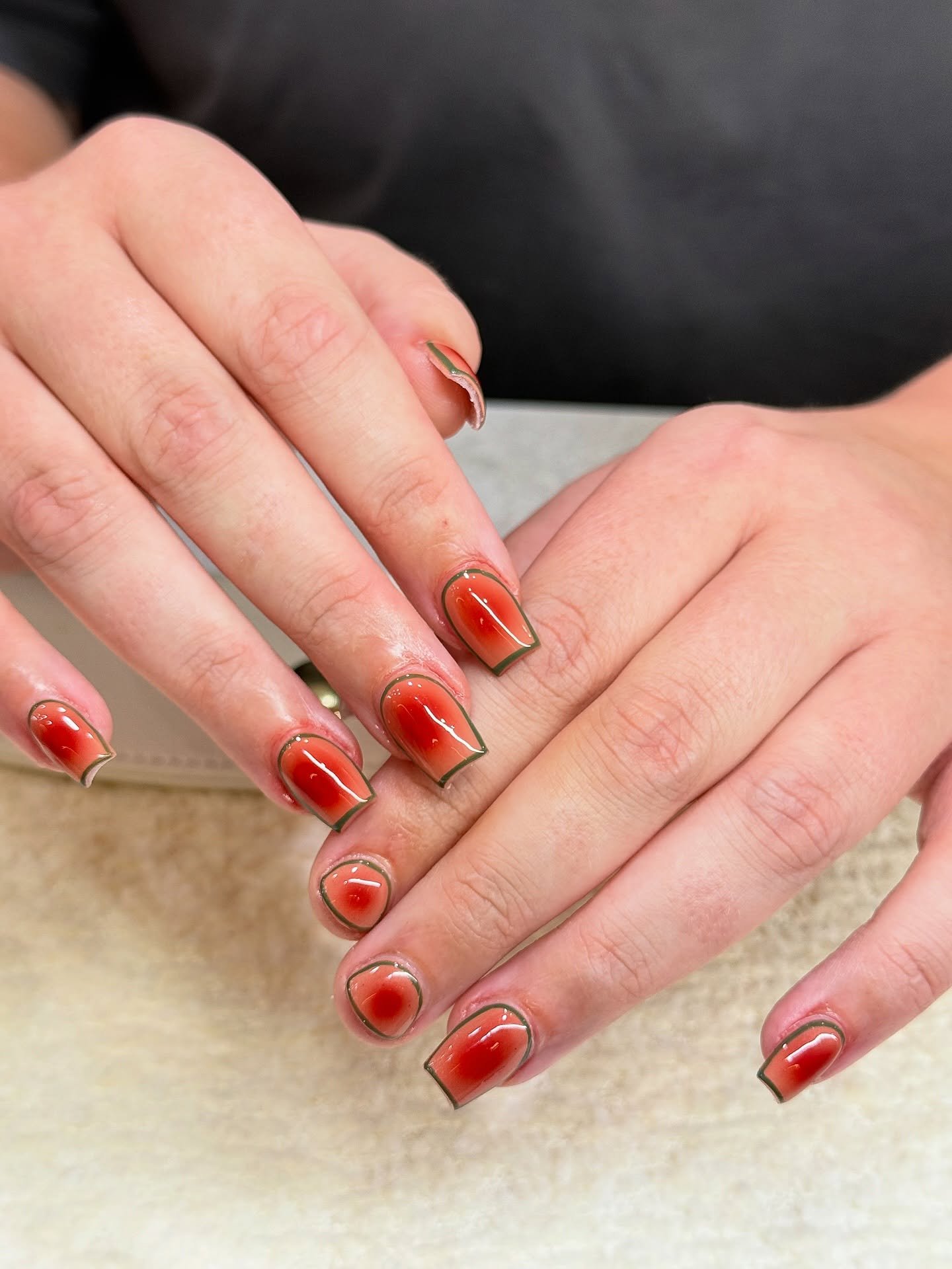 Blood orange aura nails with green outline. 🧡💚

We&rsquo;re loving the growing choices for square nails lately!

Nails by Master Artist, Mia. 💥

Square nails. Short nails. Gel nail art. Aura mist. Biab. Builder gel. Acrylic nails. Gel X. Sydney na