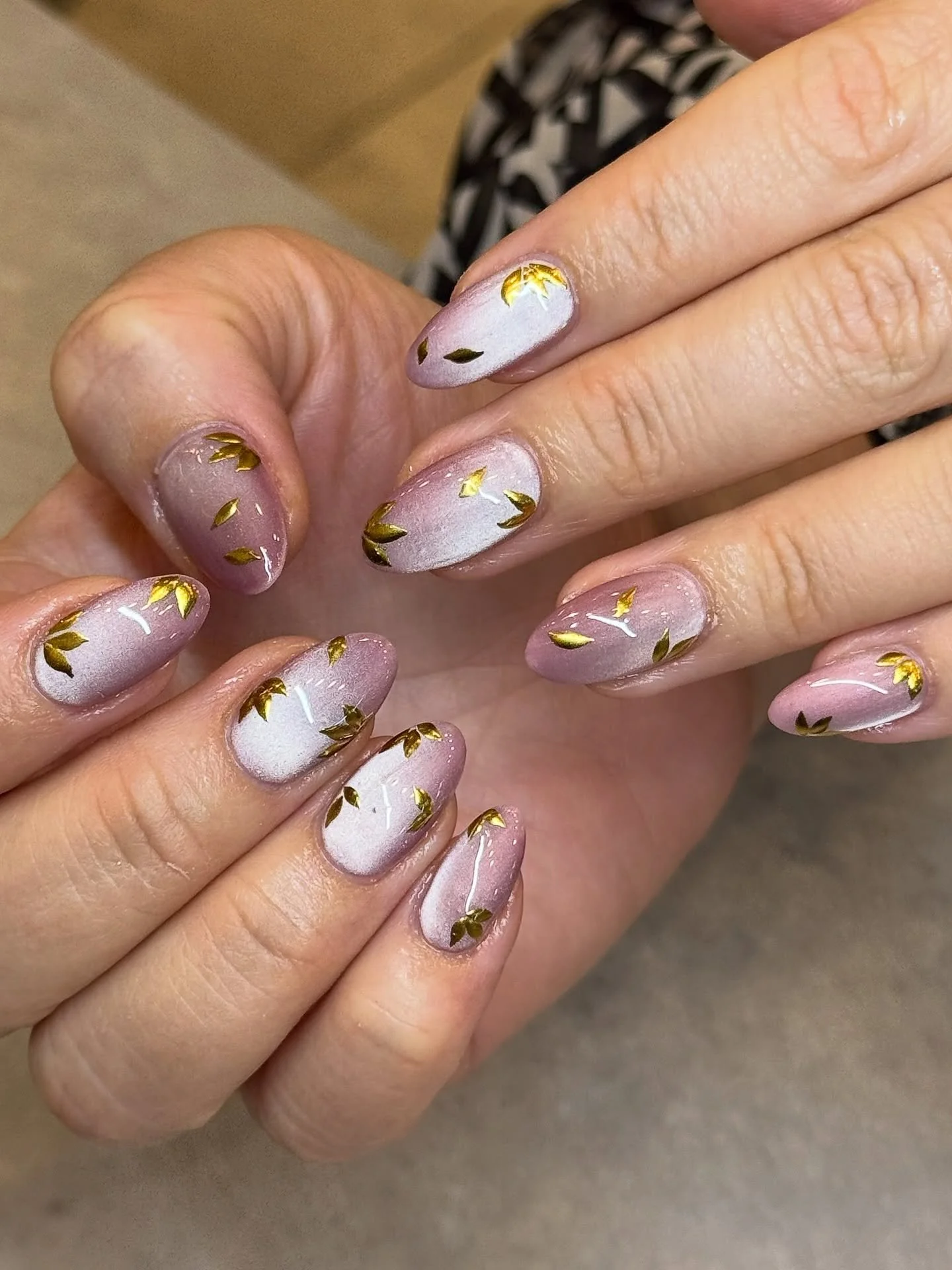 Stunning pink cat eye nails with gold petals. Perfect for every season and occasion. 💗

Nails by Standard Artist, Kylie. 🎀

PSA: We are no longer offering SNS nail services. We highly recommend trying out BIAB. 

Cat eye effect nails. Builder gel. 