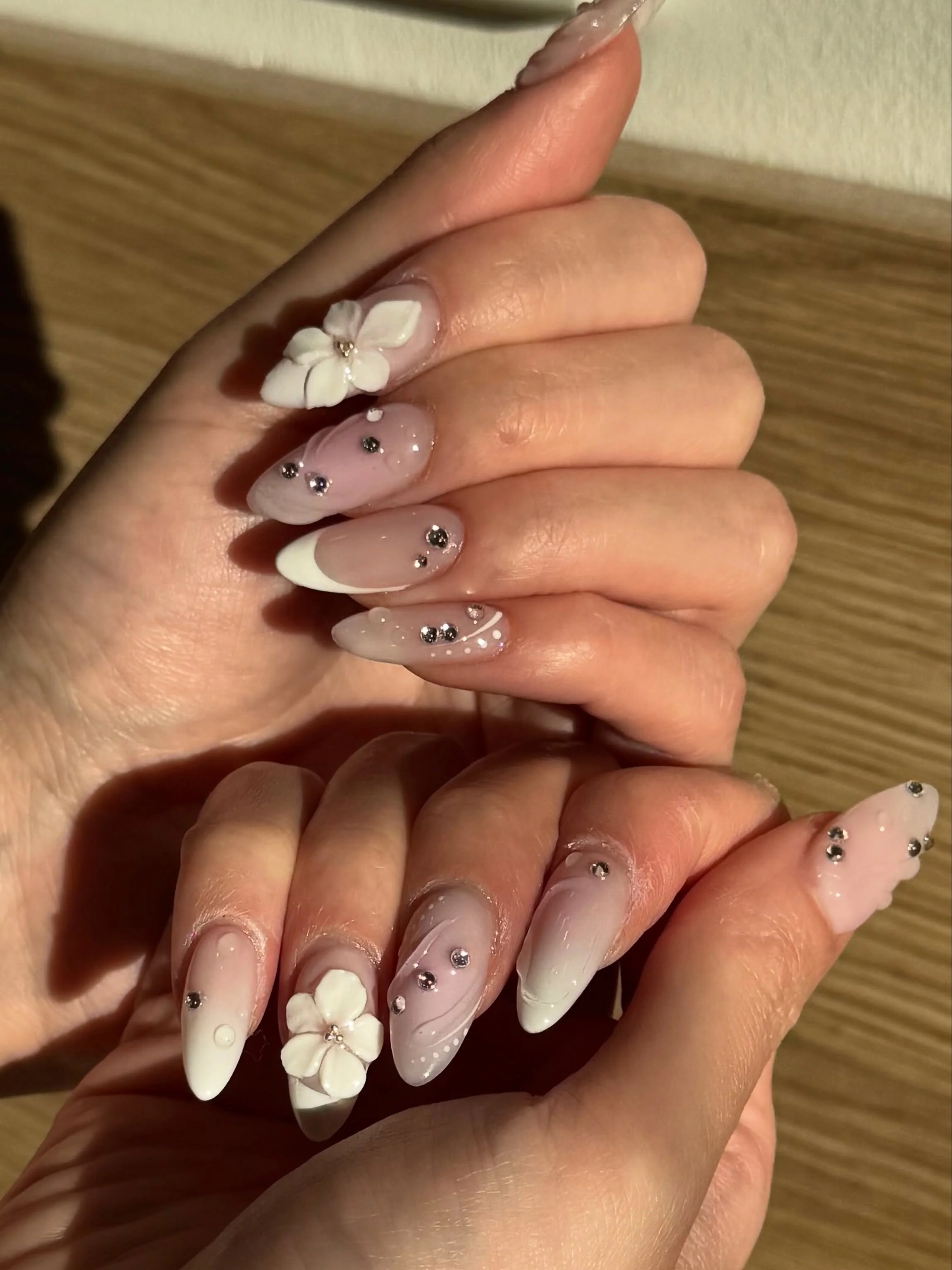 Pretty nails looking wifey material. 🤍💍

Nails by Senior Artist, Sarah. 💐

#bridalnails #whitenails #frenchtipnails #3dnailart #3dflowernails 3D nail art, gel nail art, 3d flower nails, white nails, nail gems, French tip nails, nude nails, almond 