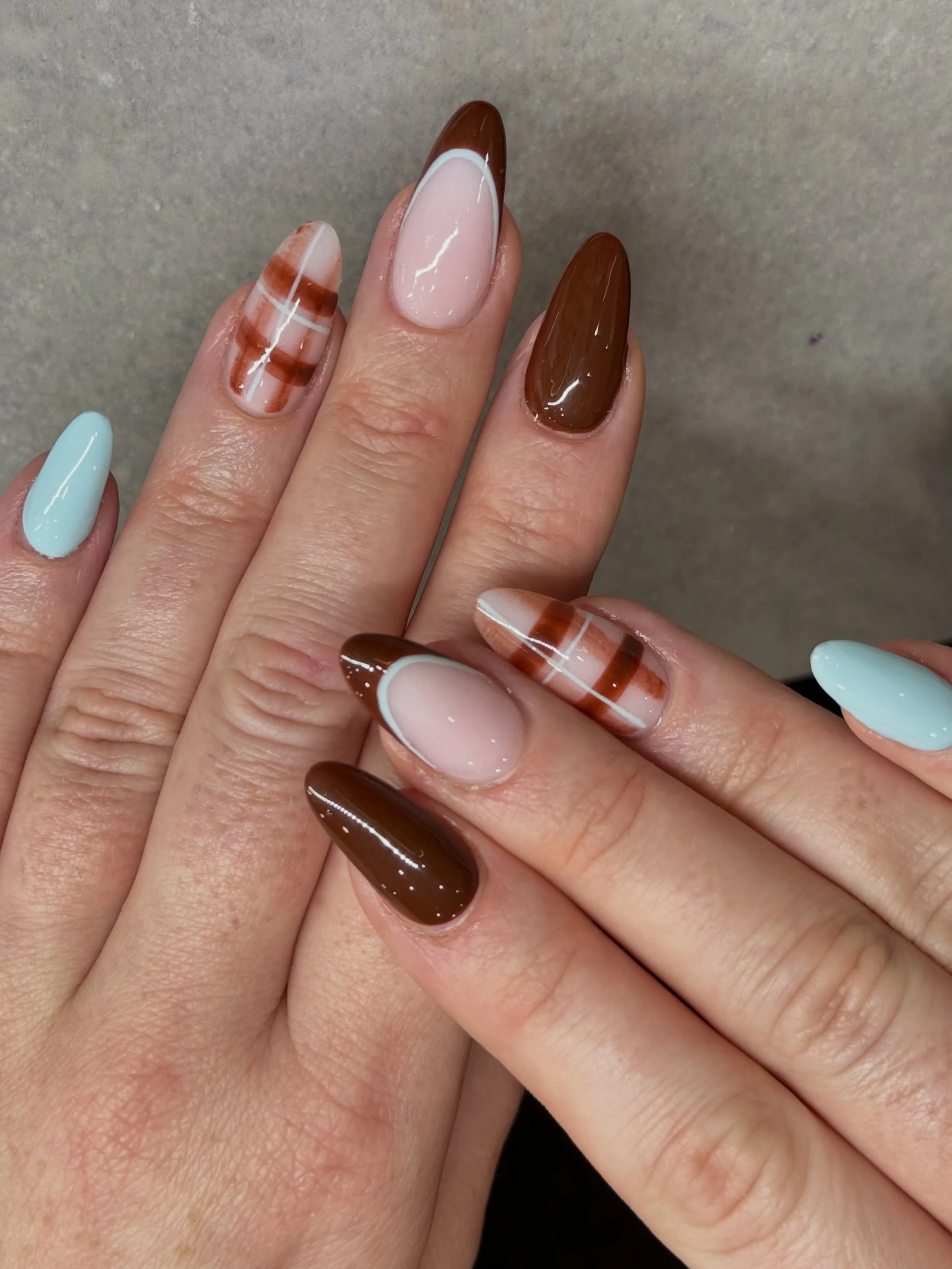 Cozy nails for autumn. 🤎🩵

Nails by Master Artist, Mia. 🐻 

#brownnails #autumnnails #fallnails #almondnails #gelx brown nails, fall nails, autumn nails, biab, builder gel, gel x, tartan nails, checkered nails, French tip nails, gel nail art