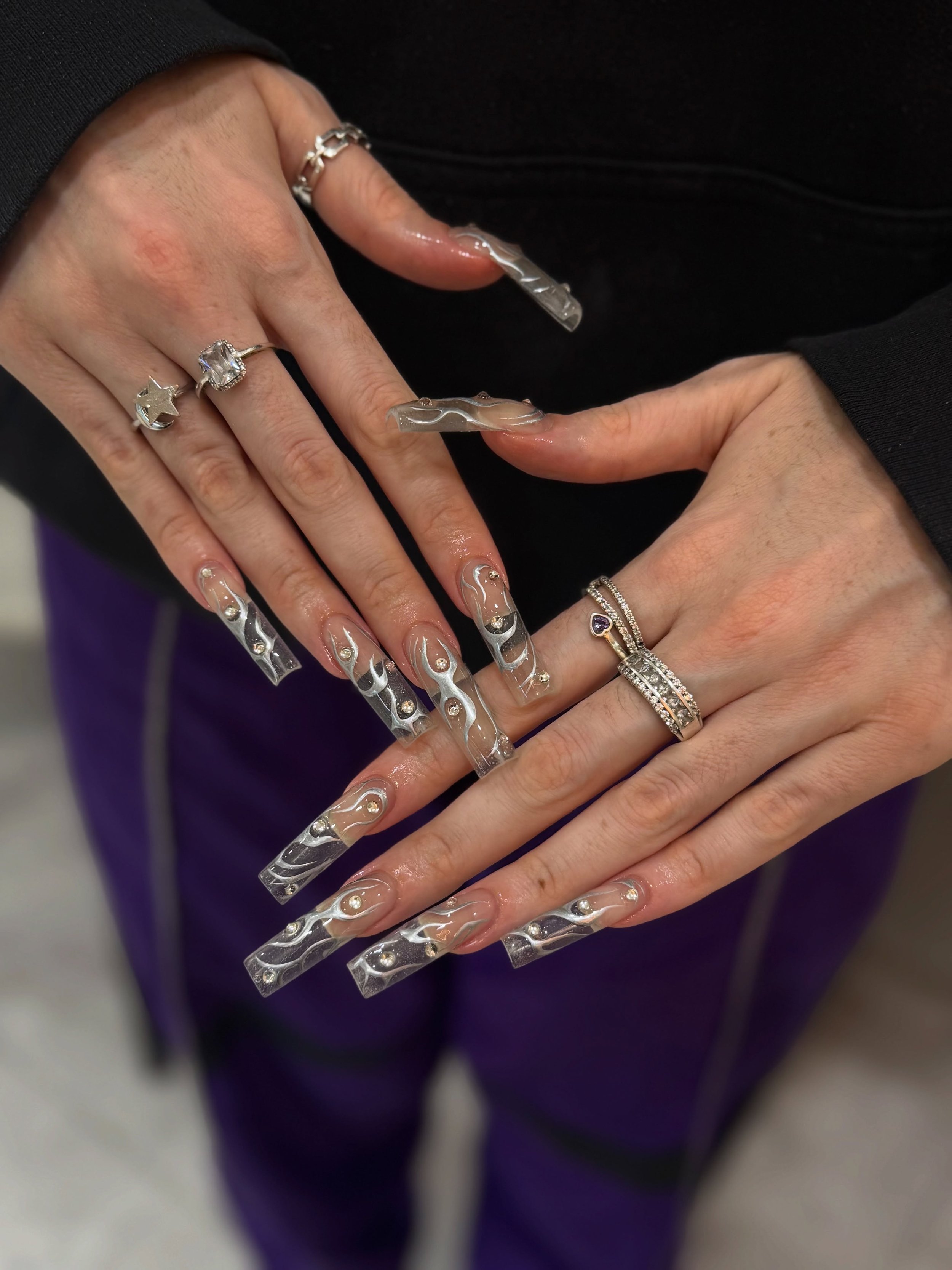 Cyber nails go crazy. ❤️&zwj;🔥⛓️

Nails by Master Artist, Amy. 🩶

#cybernails #y2knails #cybersigilism #xxlnails #squarenails cyber sigilism, XXL nails, y2k nails, square nails, long acrylic nails, see through nails, silver chrome nails, sydney nai