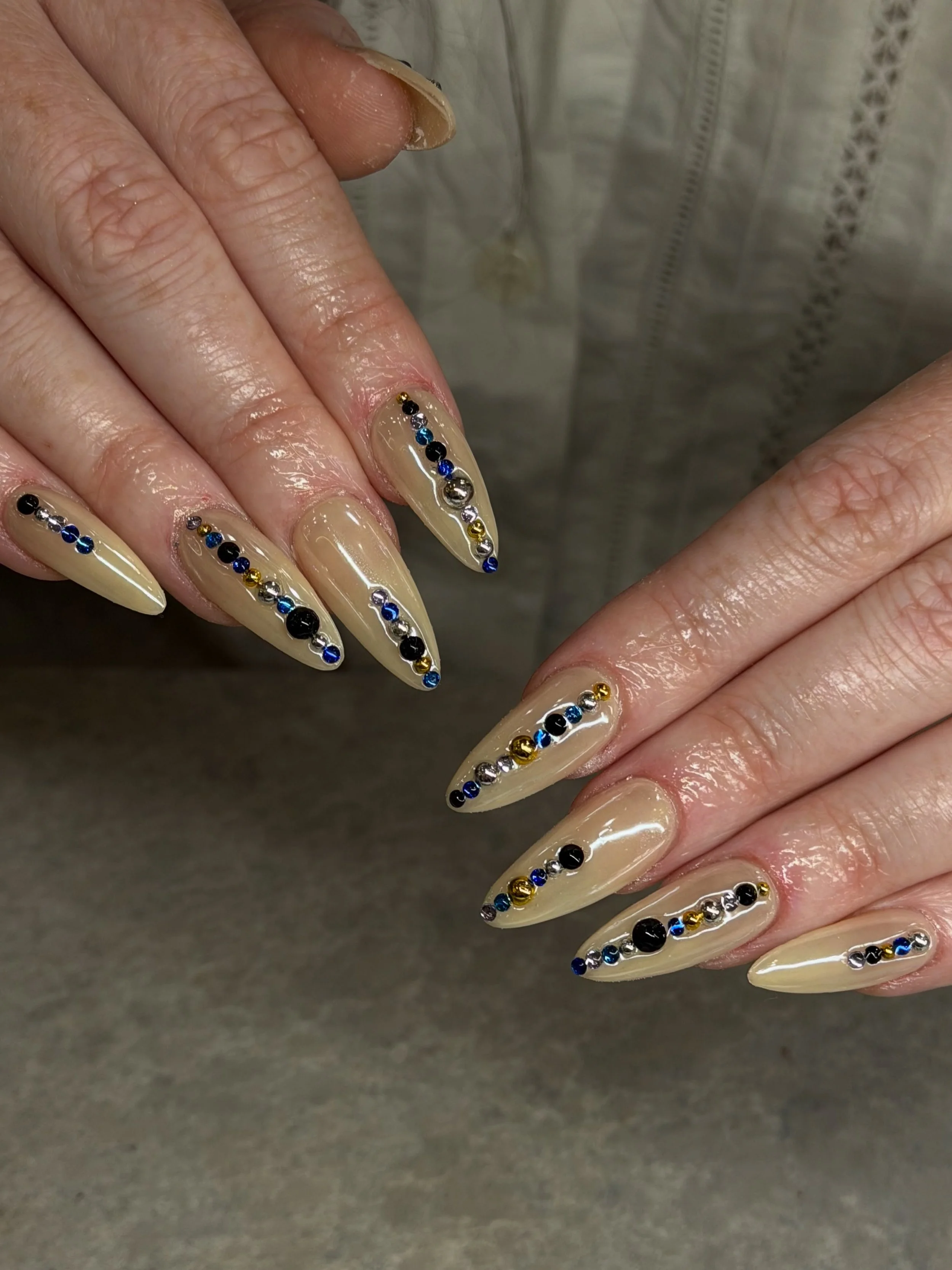 Bejewelled nails with a neutral base. 💎

Nails by Senior Artist, Tracy. 🫶🏼

#nailgems #nailcharms #nudenails #neutralnails #gelnailart nail charms, nail gems, diamond nails, diamonte nails, neutral nails, gel x, acrylic nails, long nails, almond n
