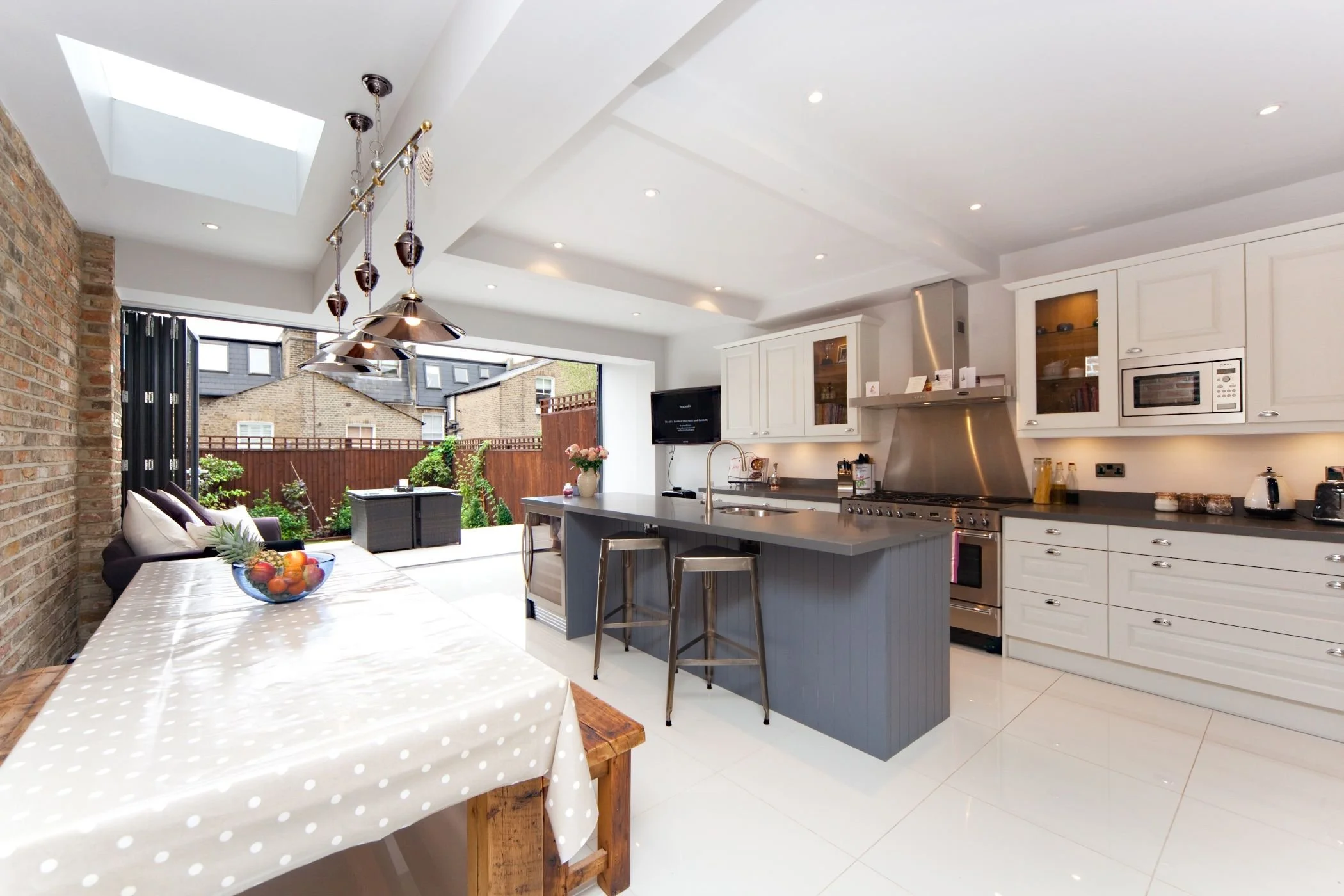 A kitchen with a table and chairs