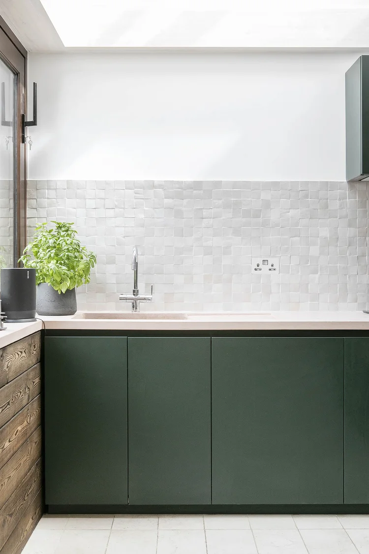 CHECK: describe what's actually in this photograph, e.g. a sink and tap in a boot room or utility space.