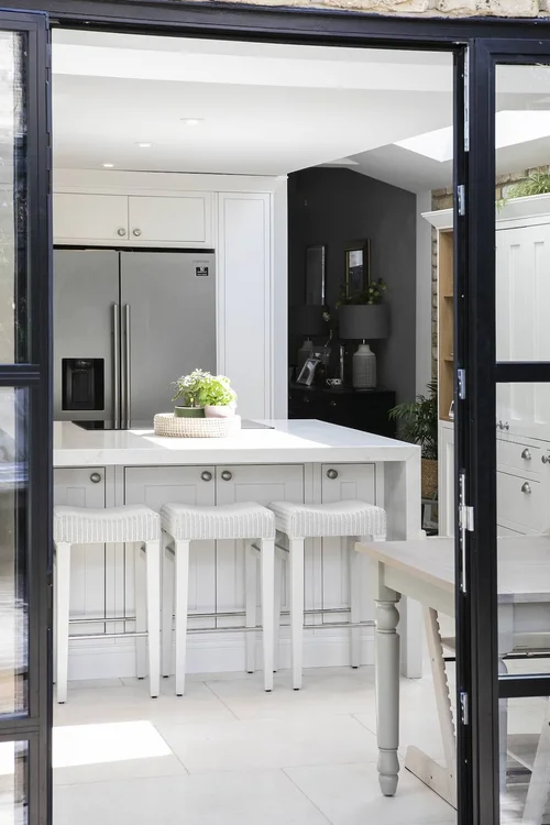 Traditional kitchen with rich wood cabinetry and classic hardware.