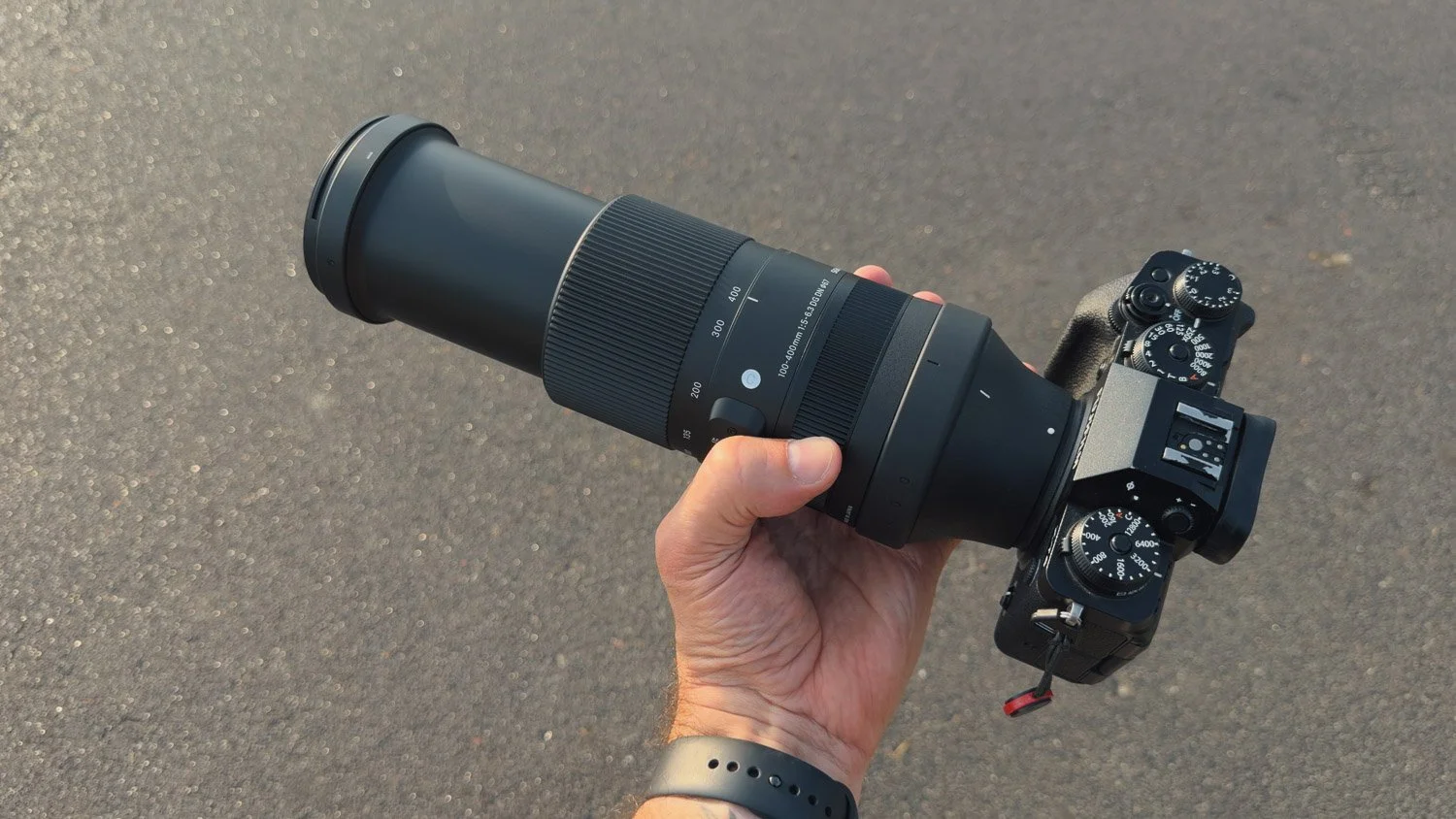 Fujifilm X-T4 with the Sigma 100–400mm lens held by hand and extended to 400mm.