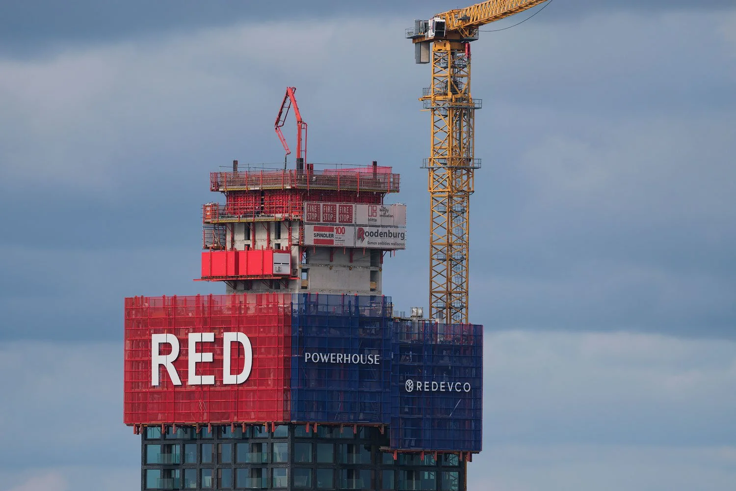 Telephoto close-up at 400mm of the RED residential tower under construction in Rotterdam.
