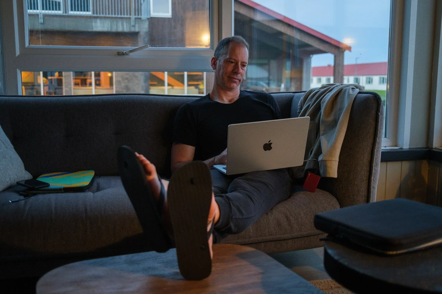 Andrea Livieri editing images on his MacBook in the evening after a great day of photography in the highlands of iceland with the workshop group