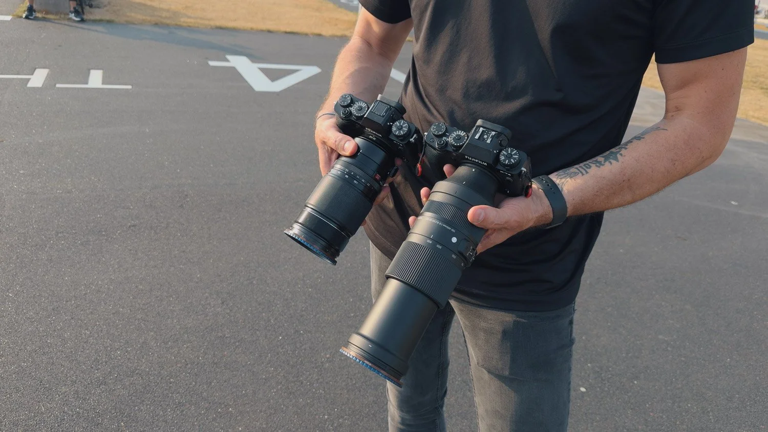 Fujinon 50-140mm and Sigma 100–400mm fully extended side by side during the Rotterdam field test.