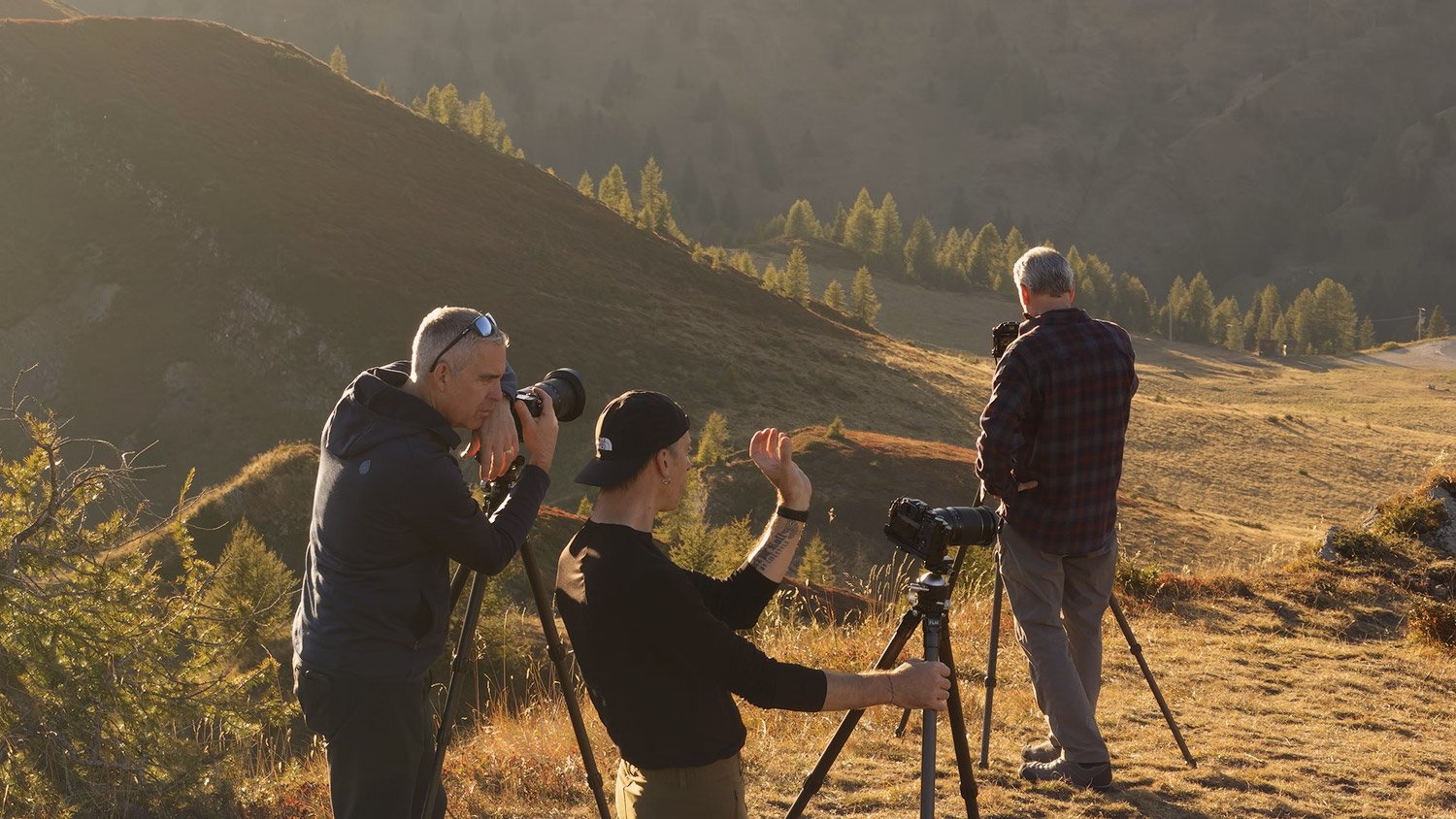 Photographers exploring compositions with tripod-mounted cameras at Passo Giau during Andrea Livieri’s Dolomites Signature Workshop.