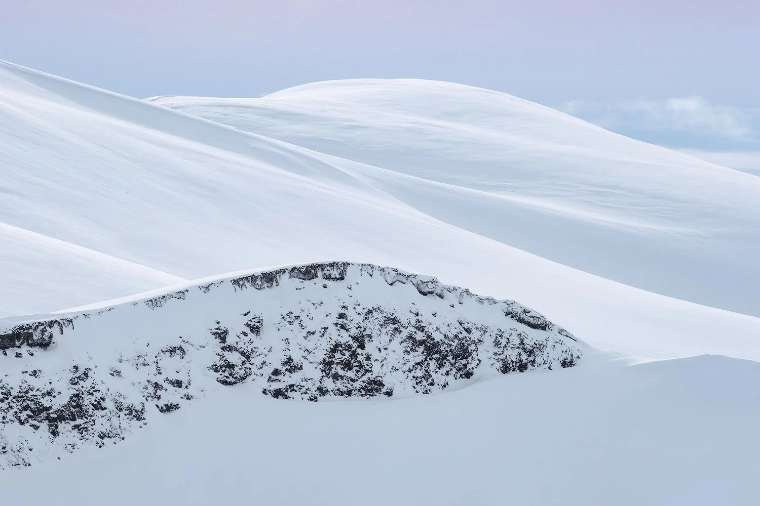 iceland in winter snow captured with the telephoto fujifilm lens