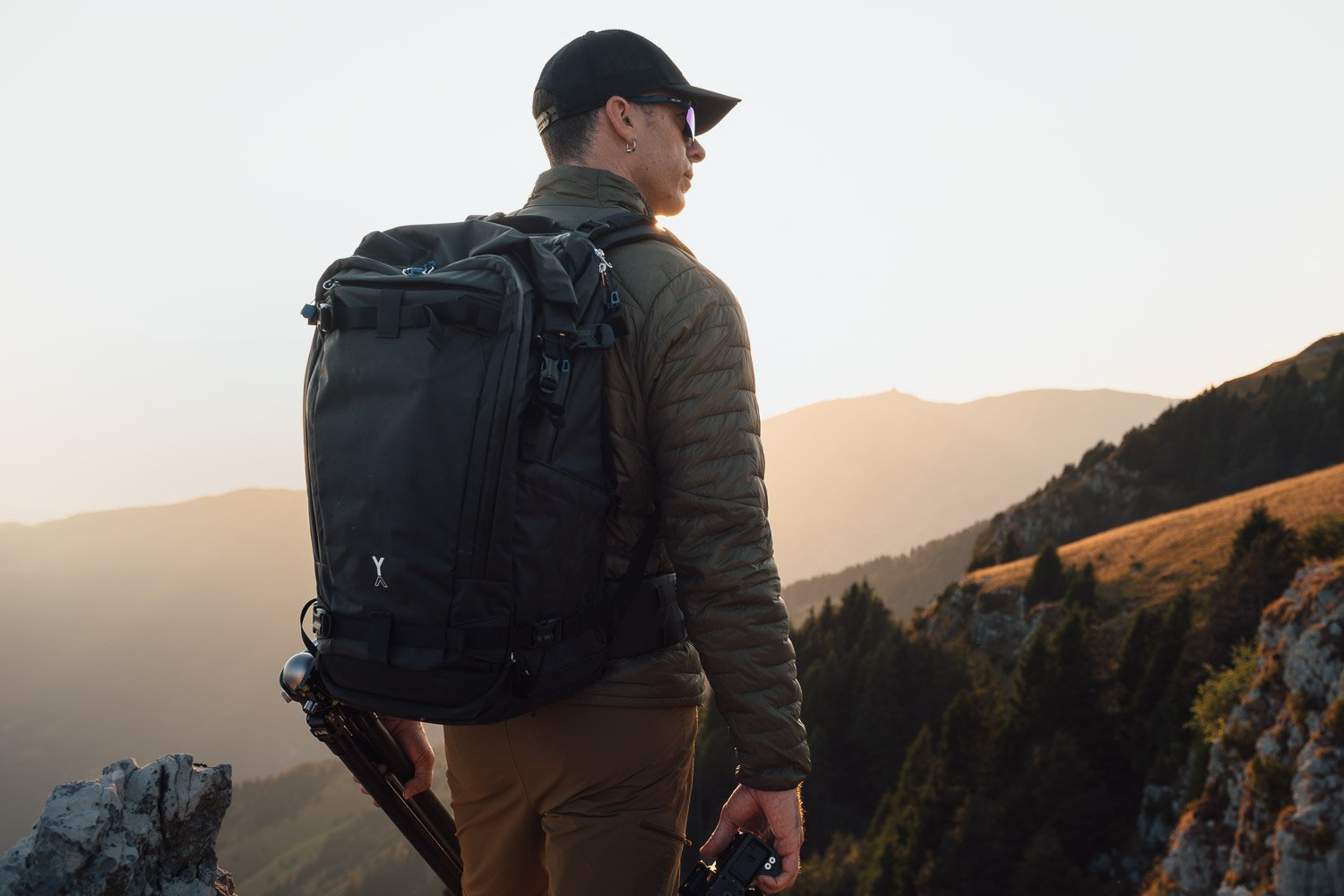 Andrea Livieri carrying the NYA-EVO FJORD 60-C camera backpack outdoors.