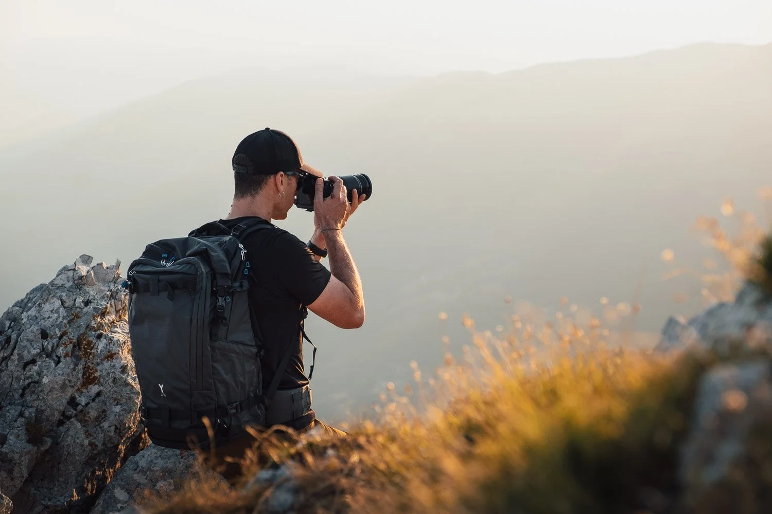 Andrea Livieri carrying the NYA-EVO FJORD 60-C camera backpack outdoors.