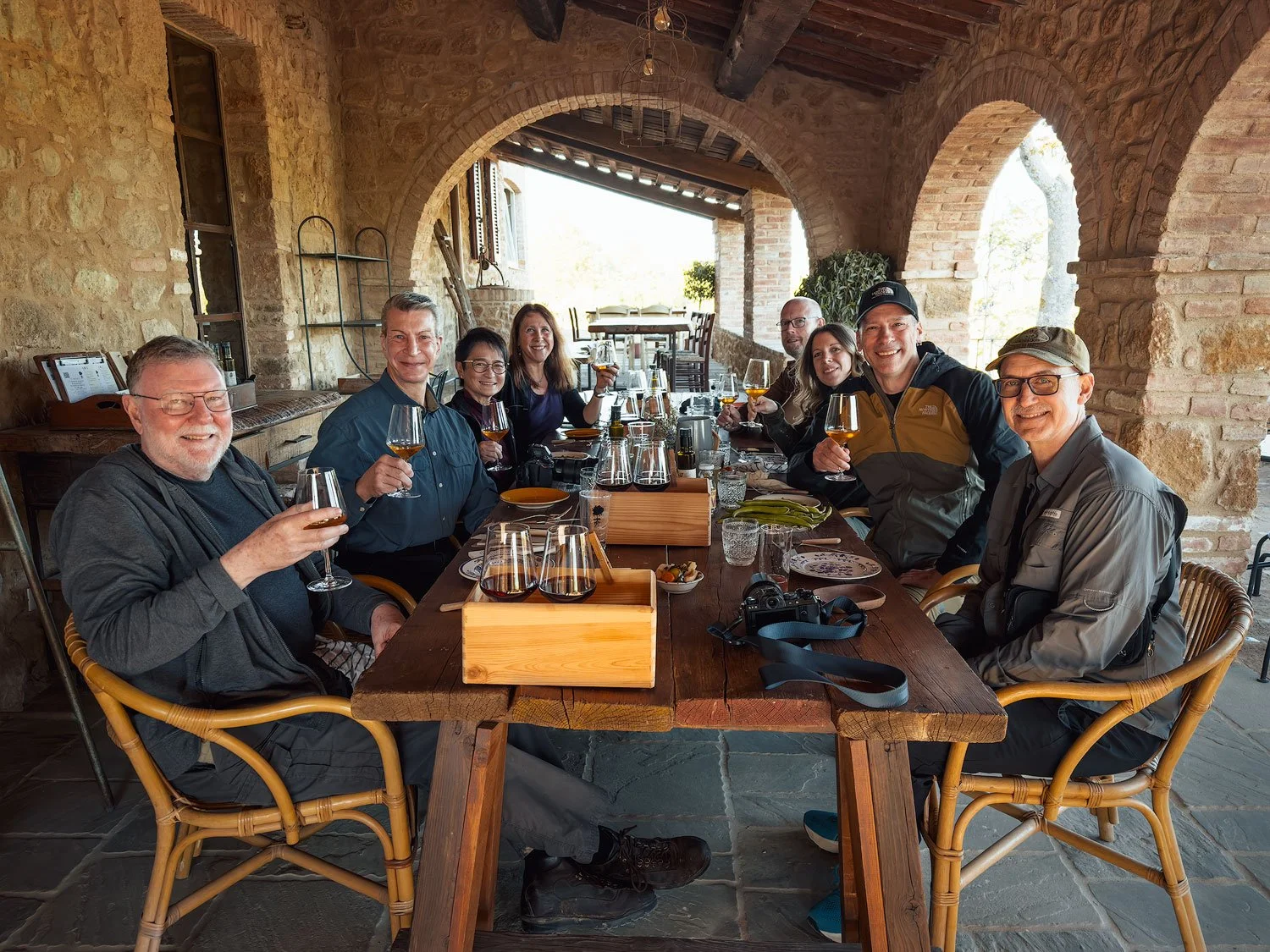 tuscany workshop group of photographers doing wine tasting