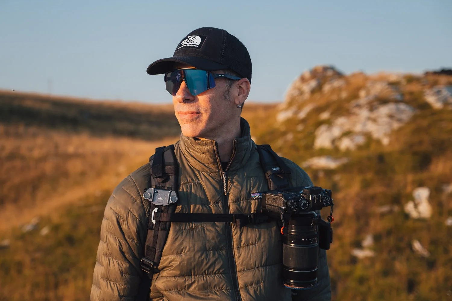 Andrea Livieri carrying the NYA-EVO FJORD 60-C camera backpack outdoors.