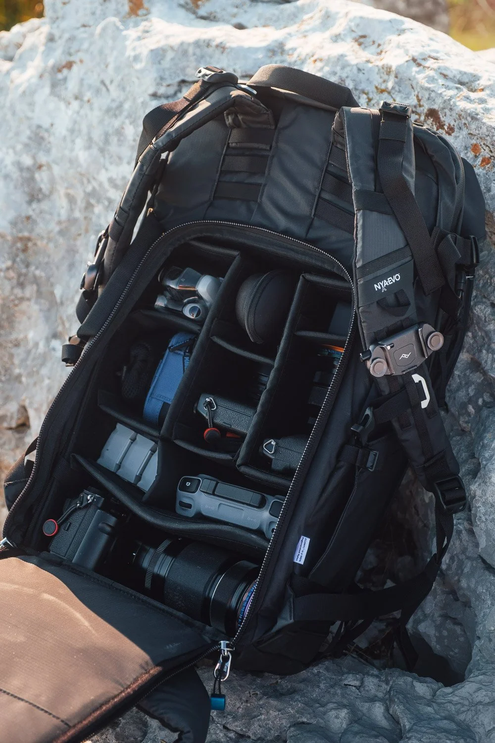 Andrea Livieri carrying the NYA-EVO FJORD 60-C camera backpack outdoors.
