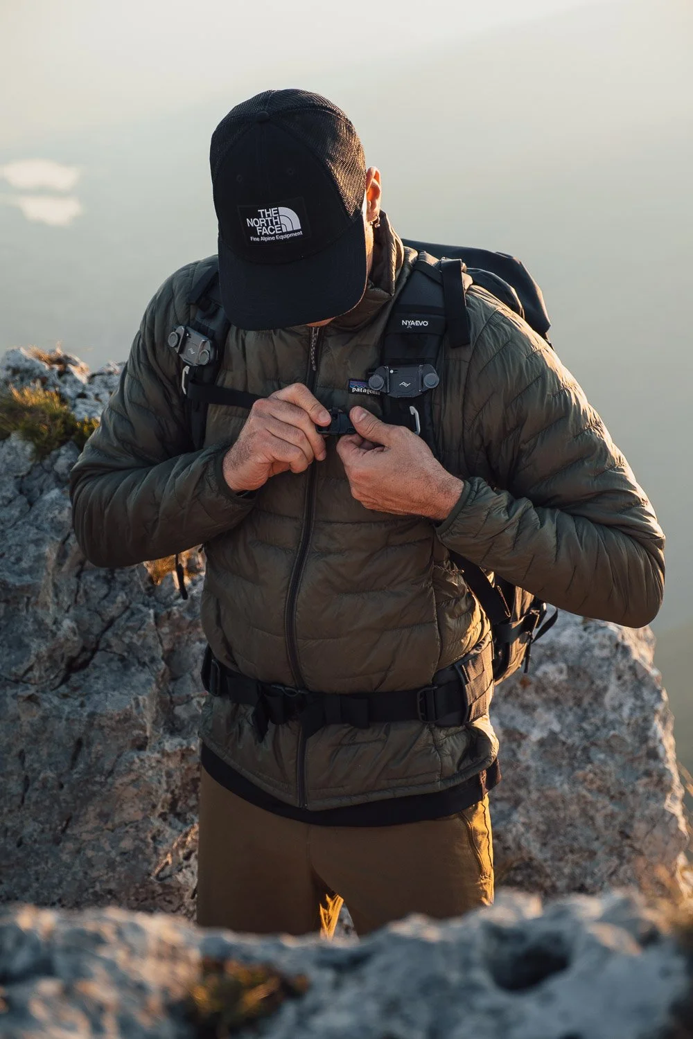 Andrea Livieri carrying the NYA-EVO FJORD 60-C camera backpack outdoors.