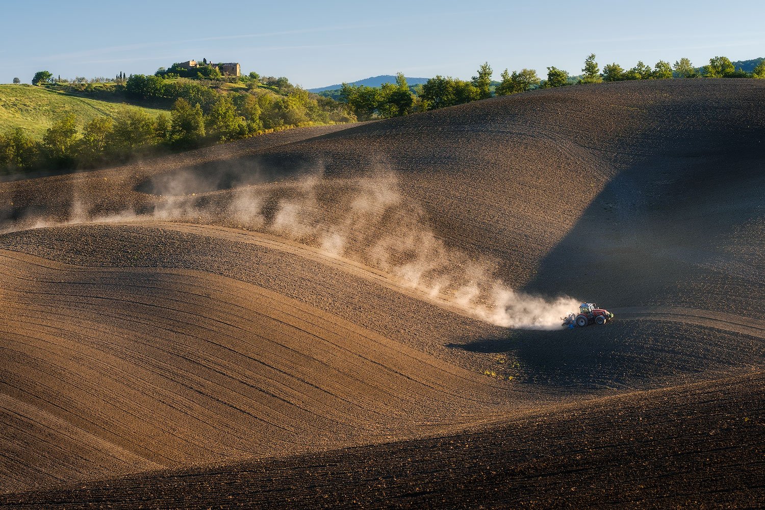 tuscany workshop tractor in the field backlit