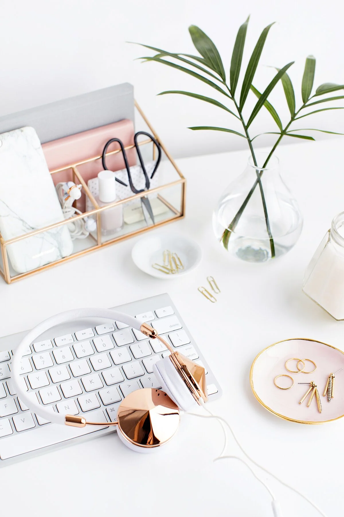 rose gold accessories on a feminine desktop