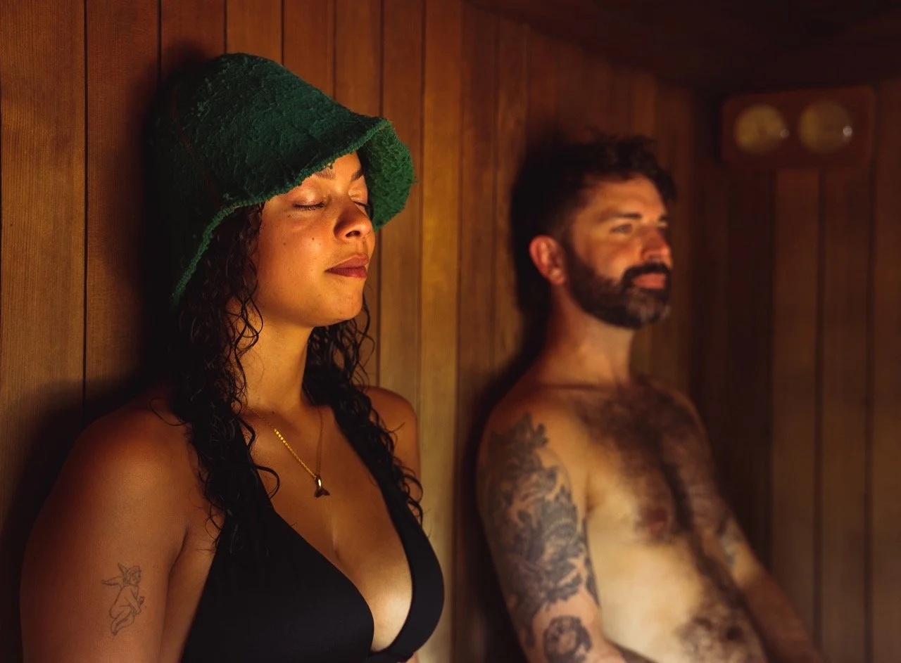 two sauna bathers relaxing eyes closed in sauna peckham community sauna baths london