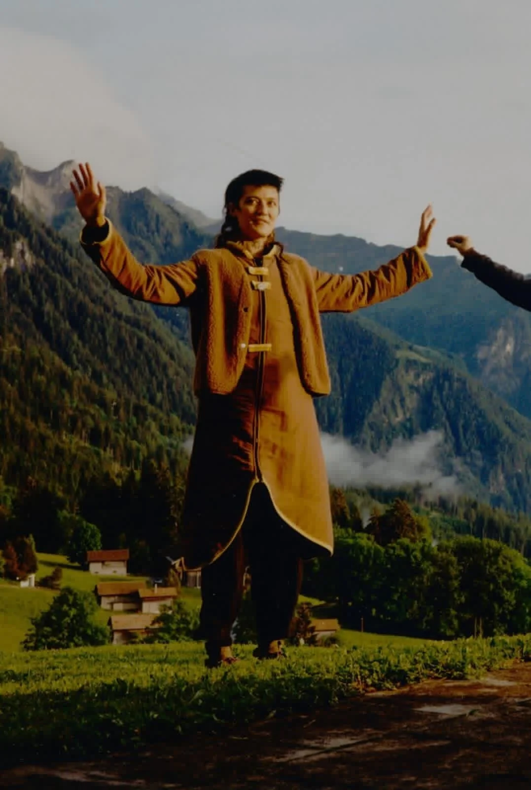 person doing qi gong in the mountains