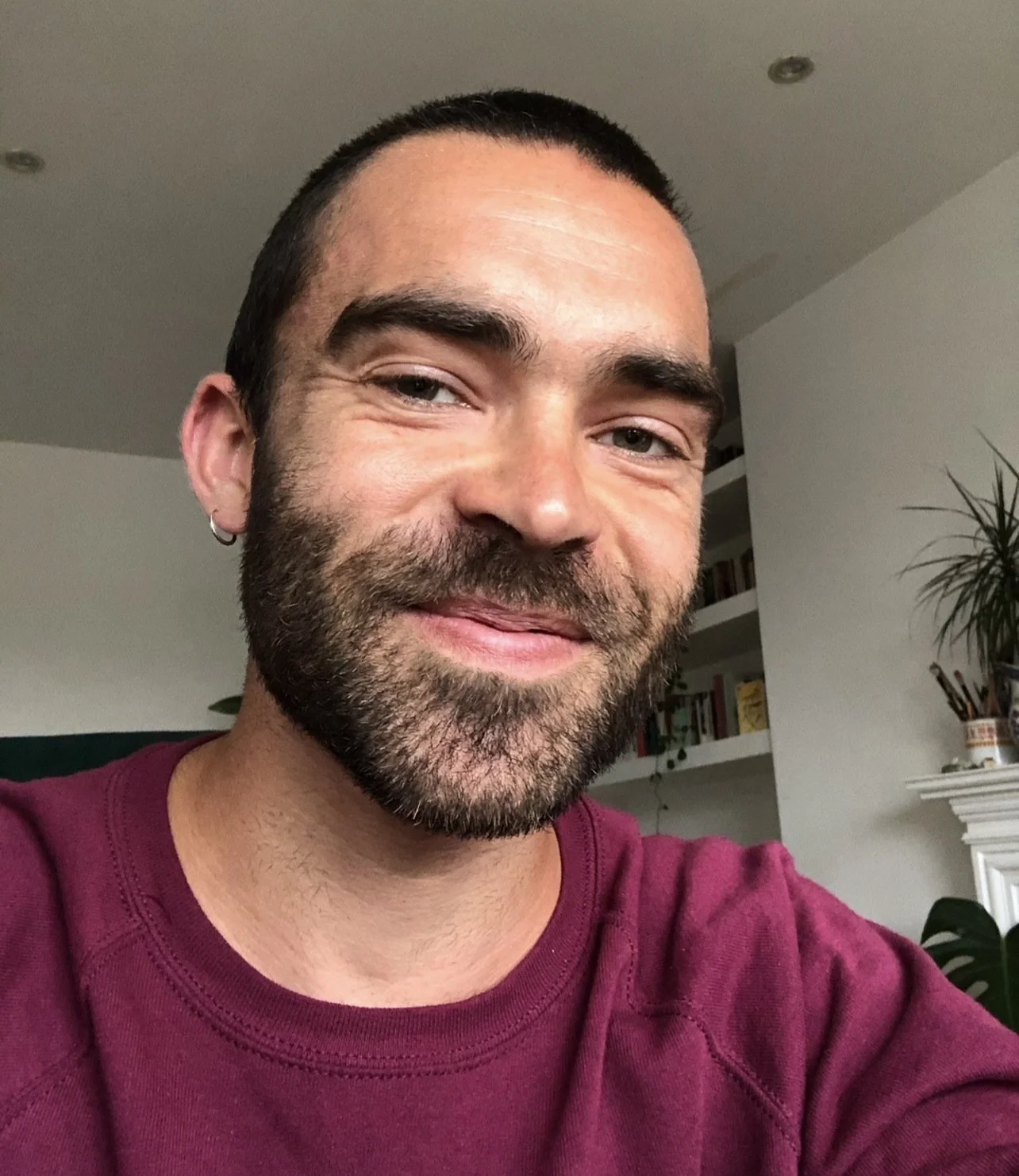 tom smiling at the camera