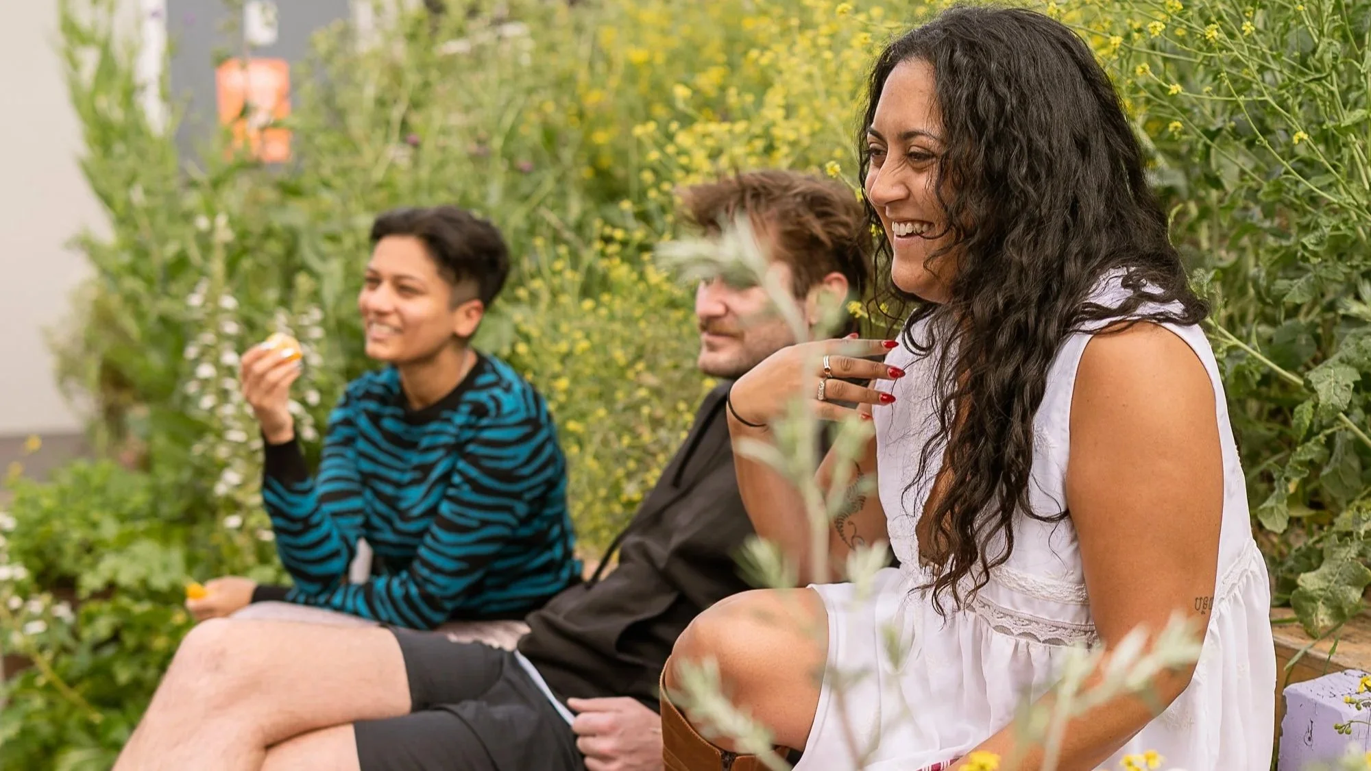 sauna bathers relaxing in the garden after a session at Stratford Community Sauna Baths London
