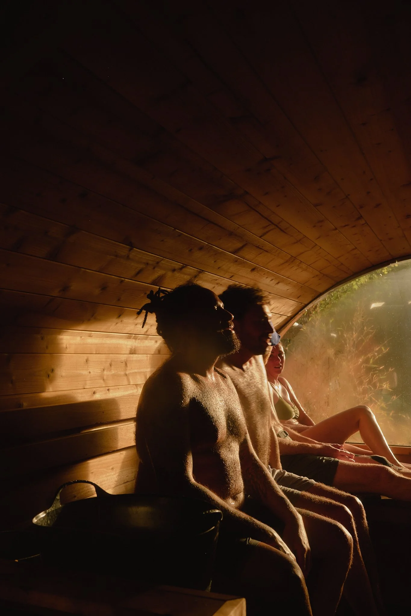 Some sauna goers sharing the steam in the sunlight at Camberwell Community Sauna Baths London