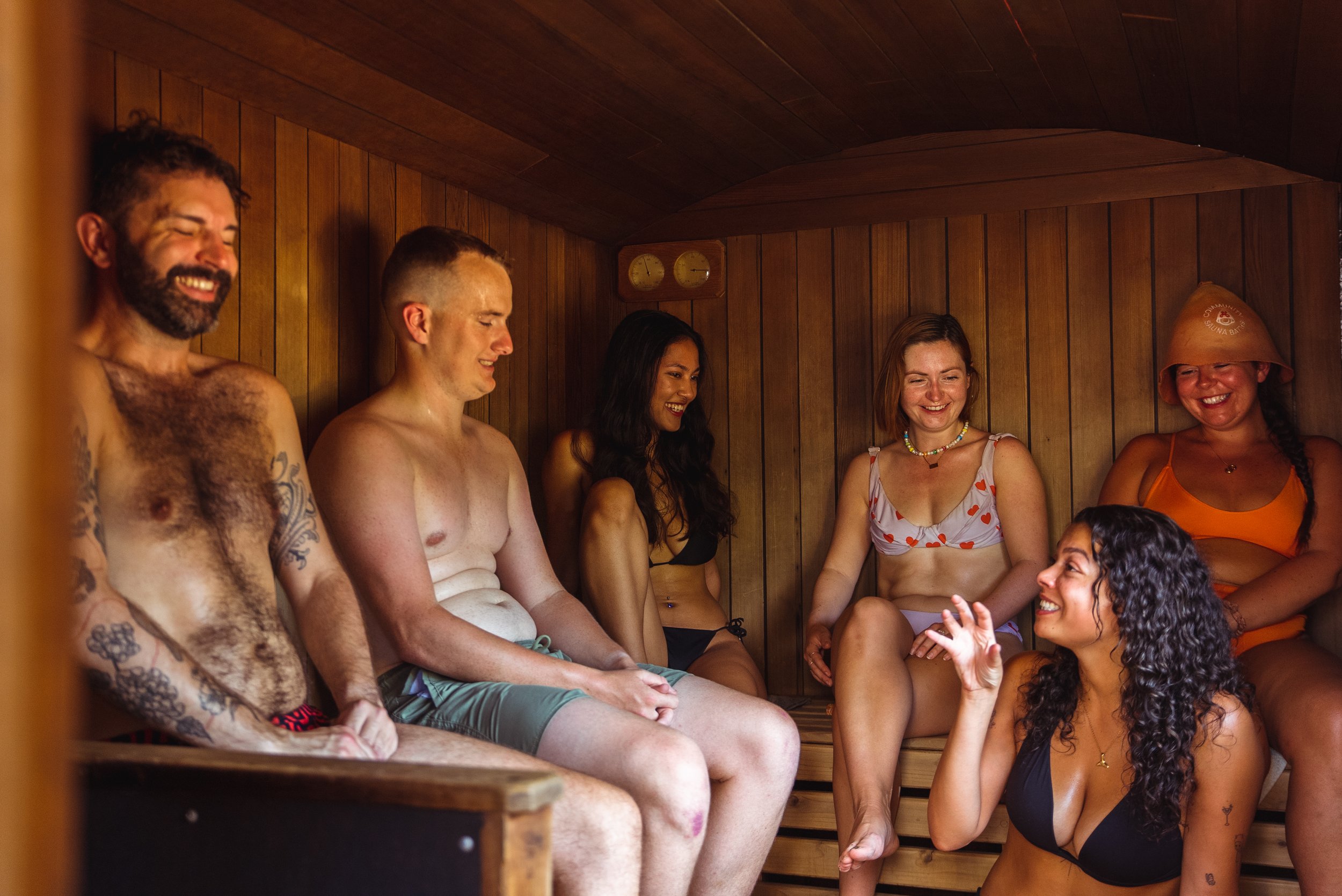 sauna bathers laughing and talking in sauna peckham community sauna baths london
