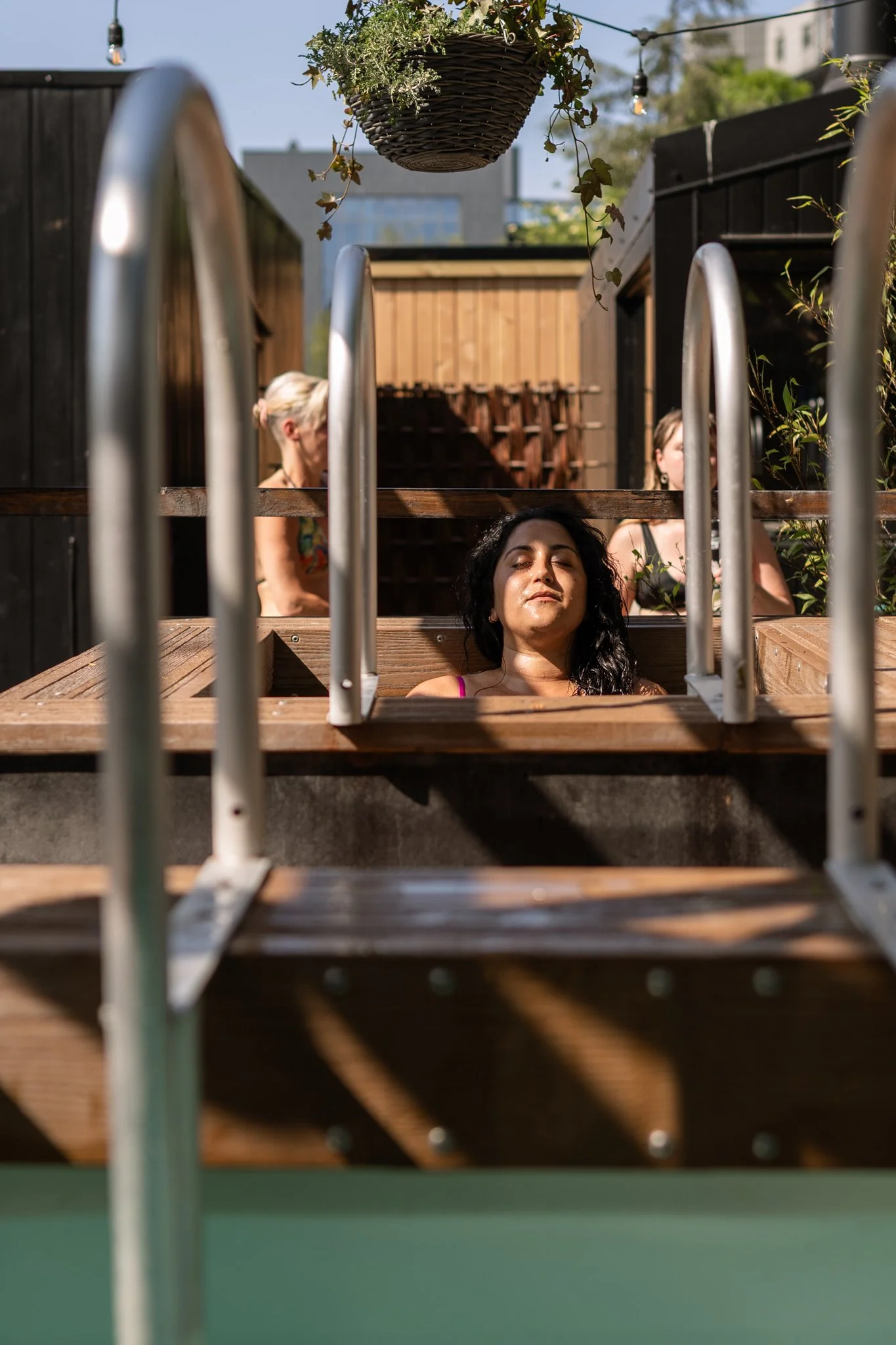 bather relaxing in the cold plunge Camberwell Community Sauna Baths London