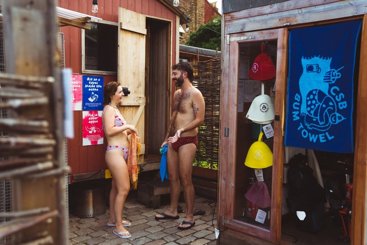 two bathers chatting in swimsuits peckham community sauna baths london