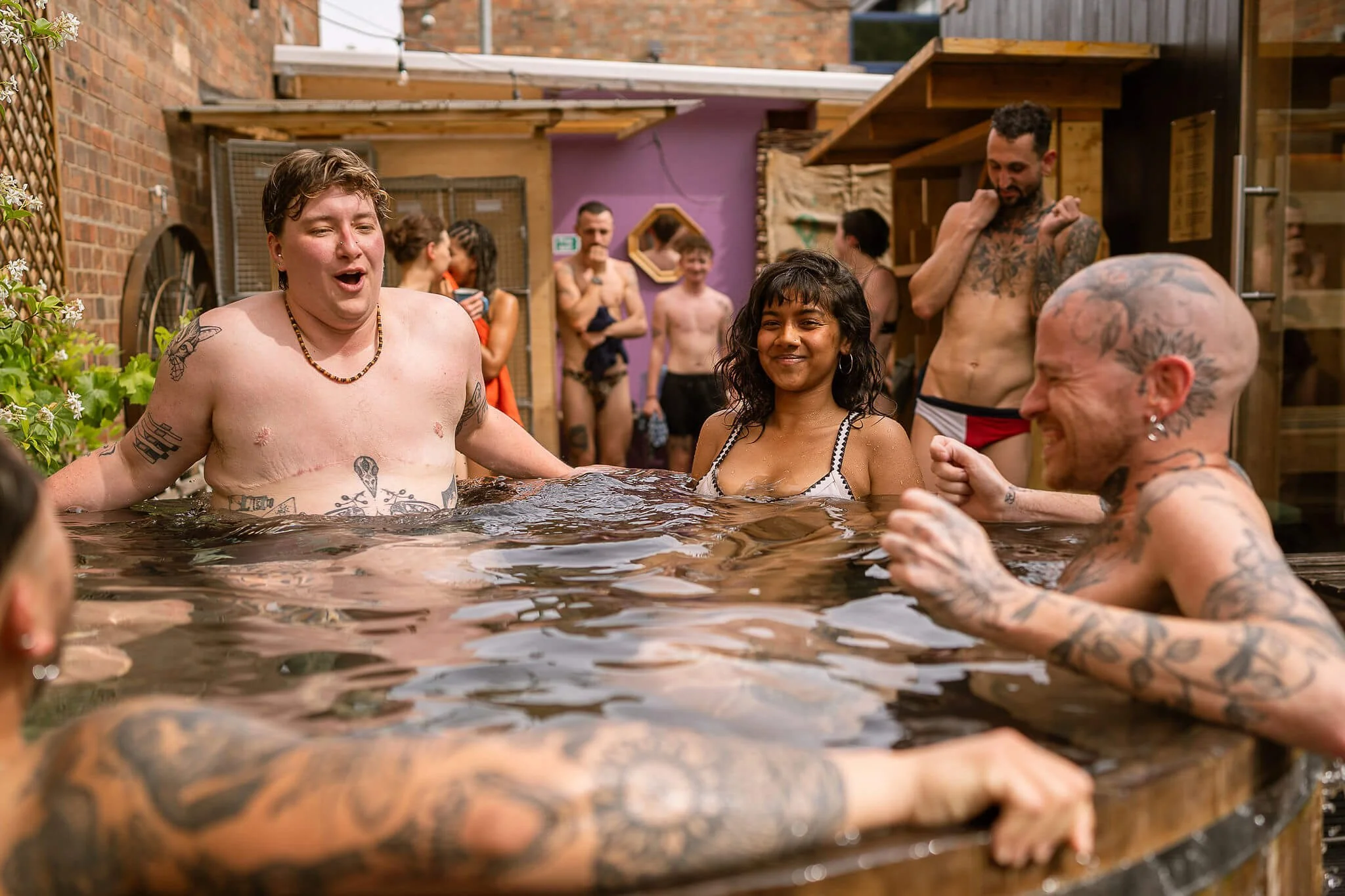 bathers enjoying the cold plunge at hackney wick community sauna baths london