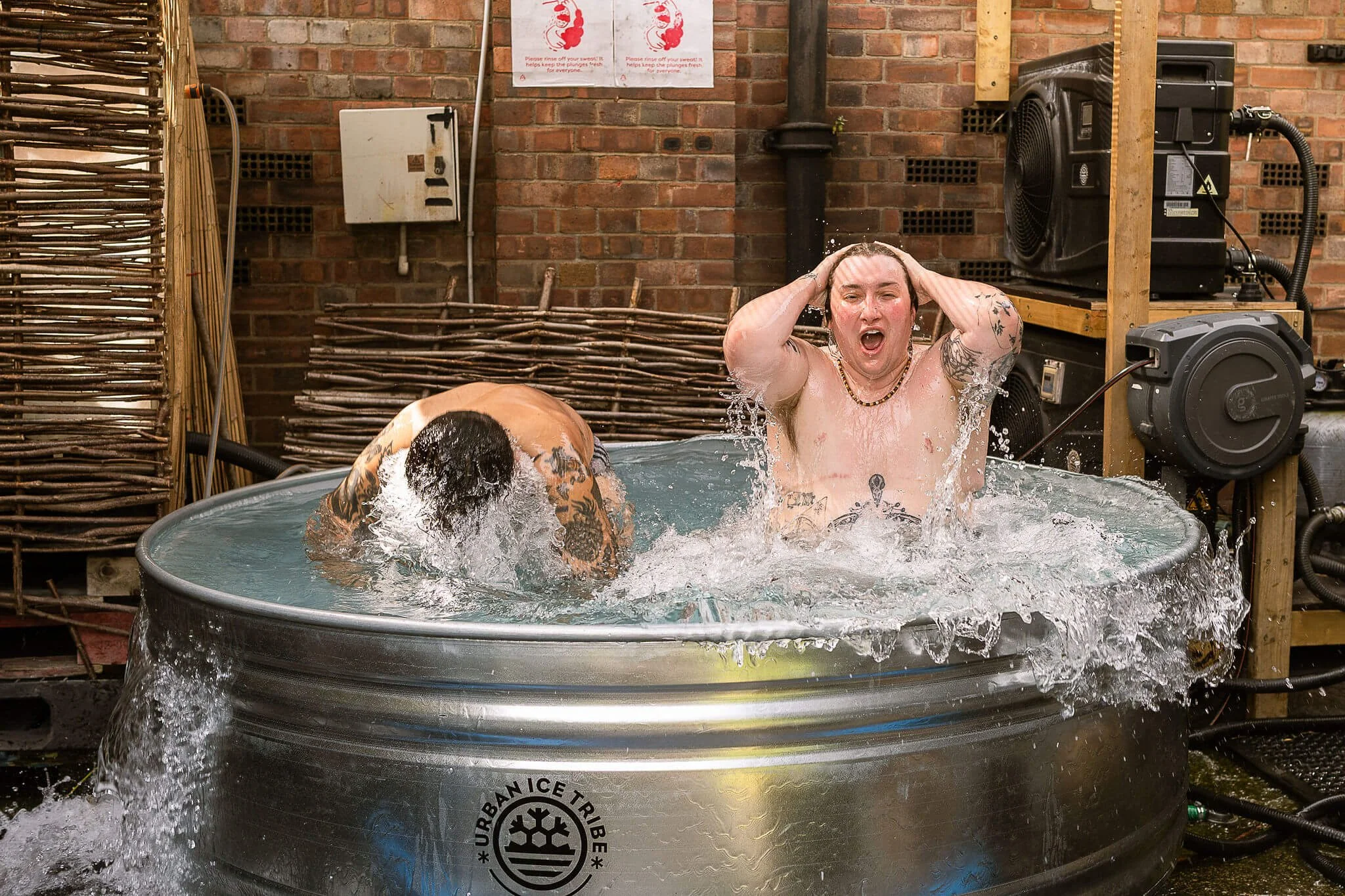 bathers enjoying a full cold plunge at hackney community sauna baths London