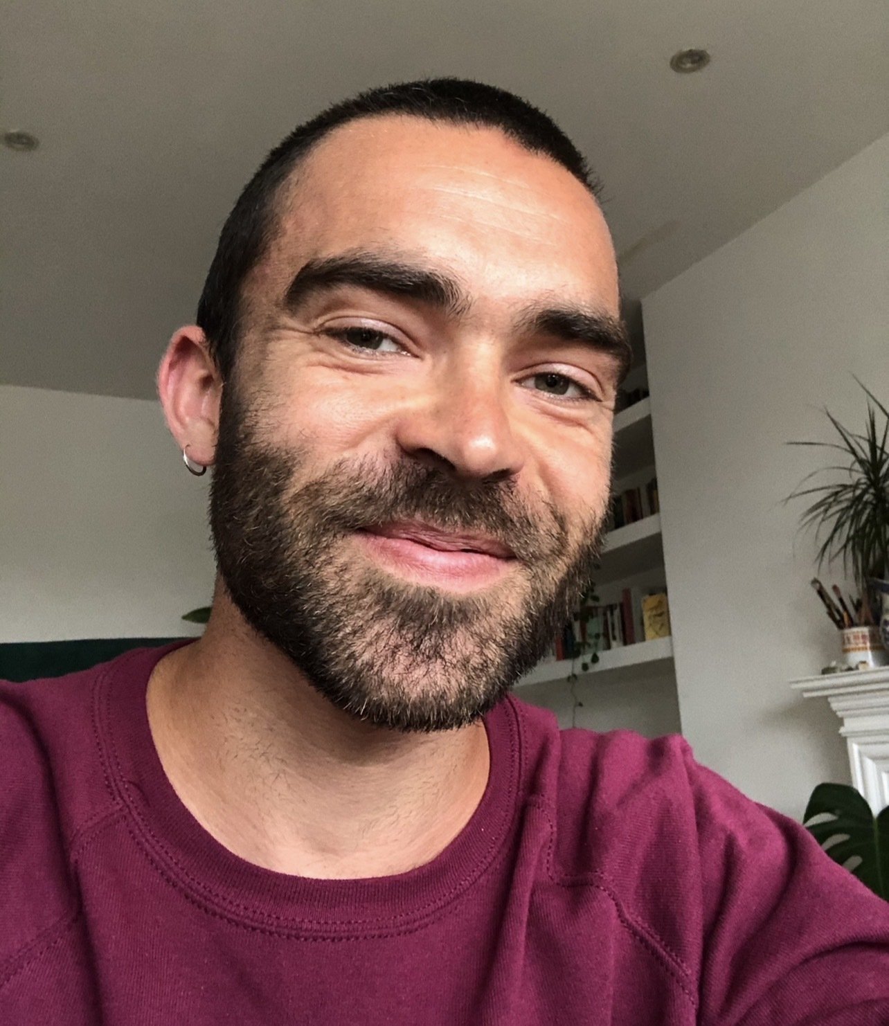 practitioner tom smiling at the camera