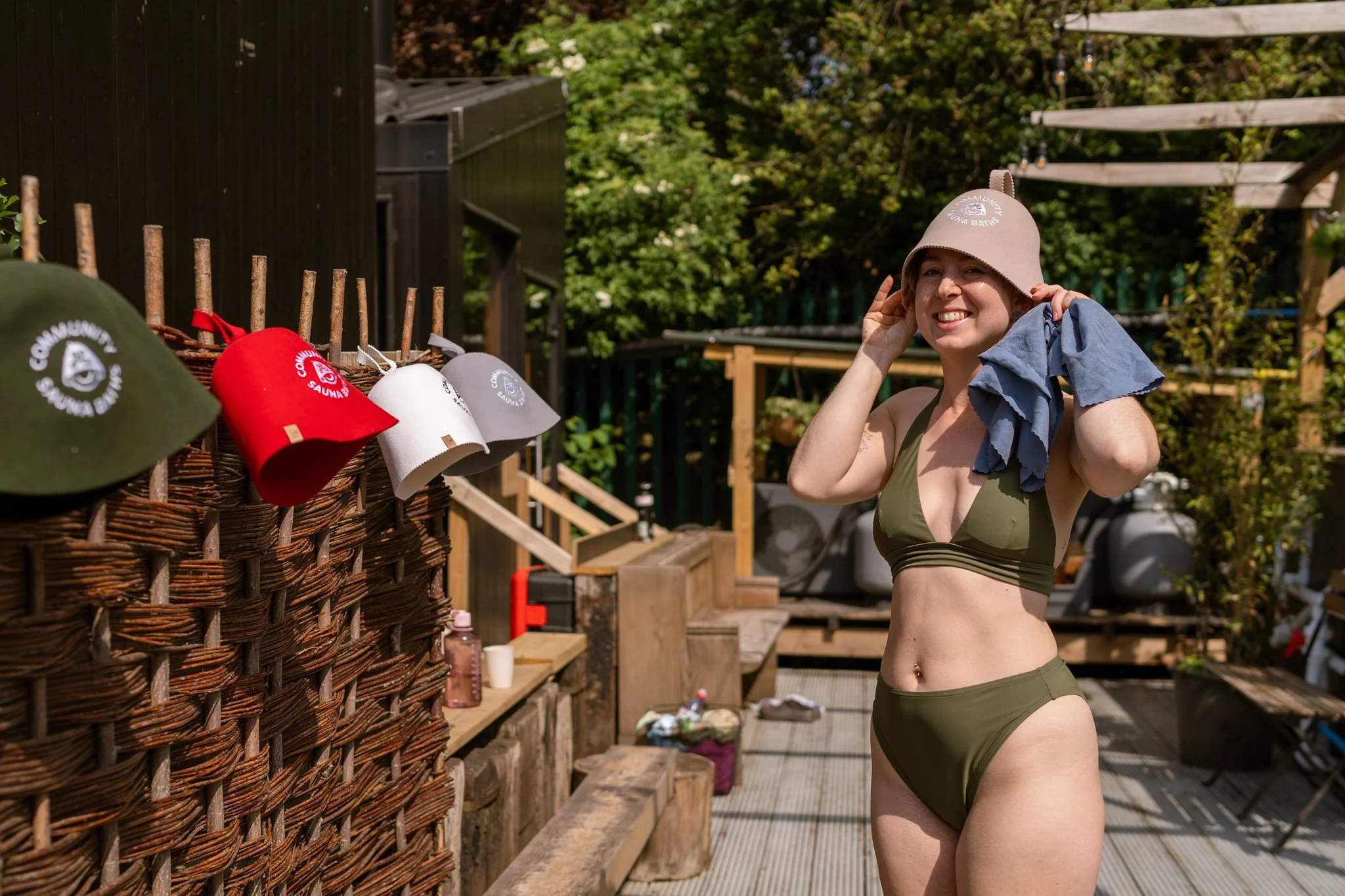 sauna goer posing with the sauna hats at Camberwell Community Sauna Baths London
