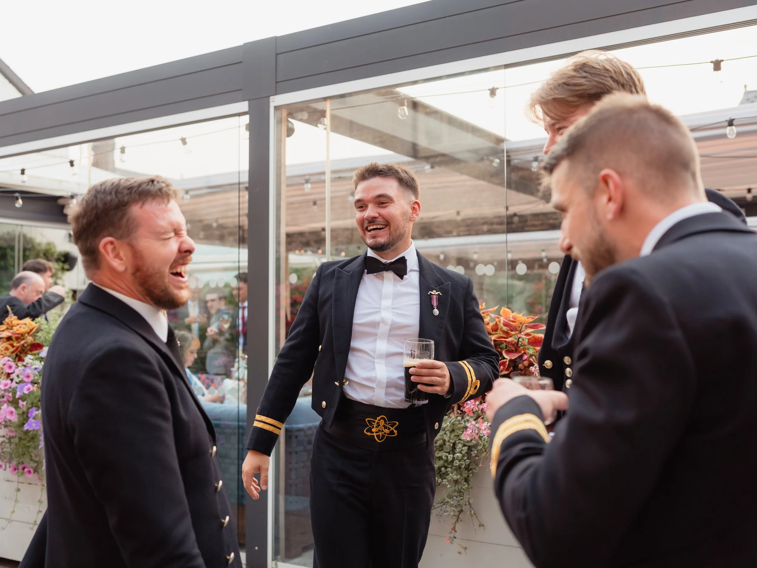 laughing wedding guests