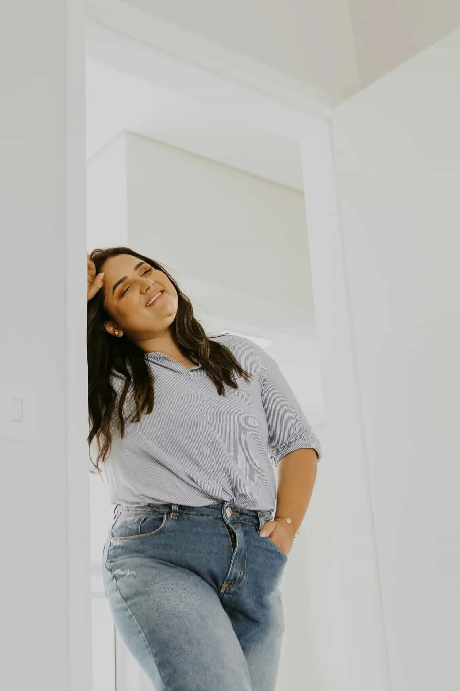 woman leaning against wall